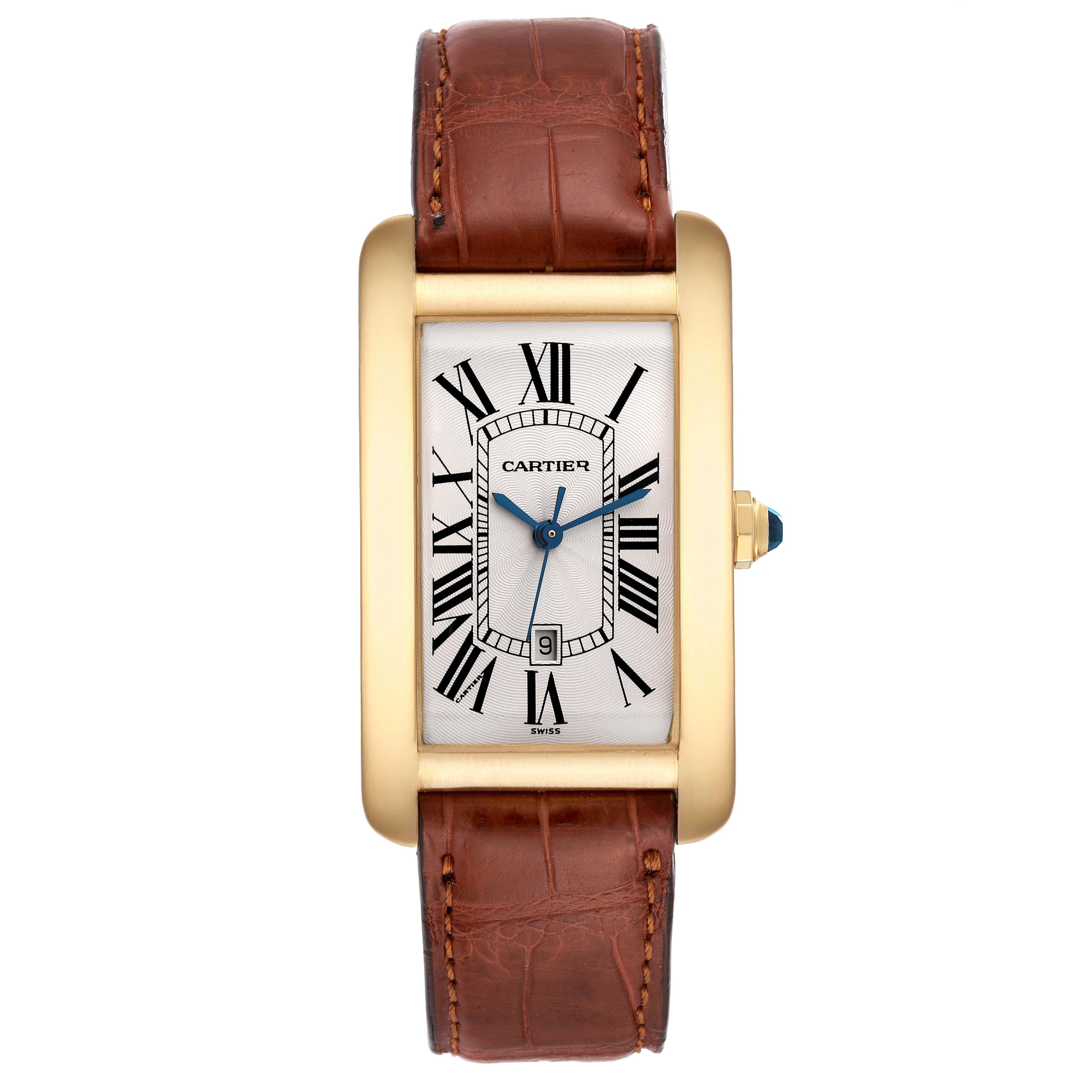 Cartier Tank Americaine Yellow Gold Automatic Mens Watch W2603156. Automatic self-winding movement. 18K yellow gold case 26.6 x 45.1 mm. Octagonal crown set with faceted blue sapphire. . Scratch resistant sapphire crystal. Silvered guilloche dial