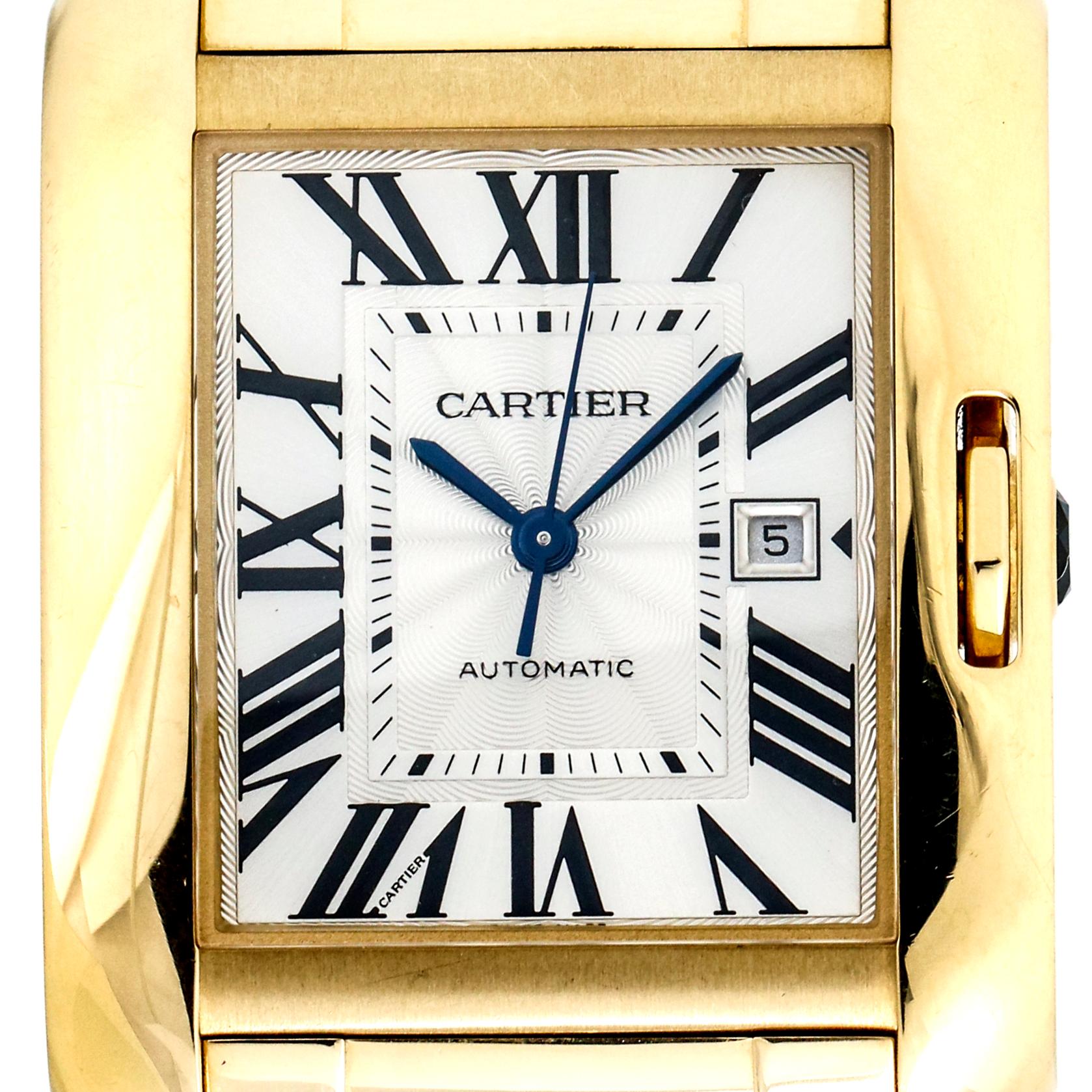 Ladies Cartier Tank Anglaise watch crafted in 18-karat yellow gold with lacquered silver dial. Signature blue sword hands and sapphire crown. Folding deployment buckle clasp. 

Case, 30mm x 39mm
Case Thickness, 10mm
Bracelet, 6.5 inches 
Lugs,