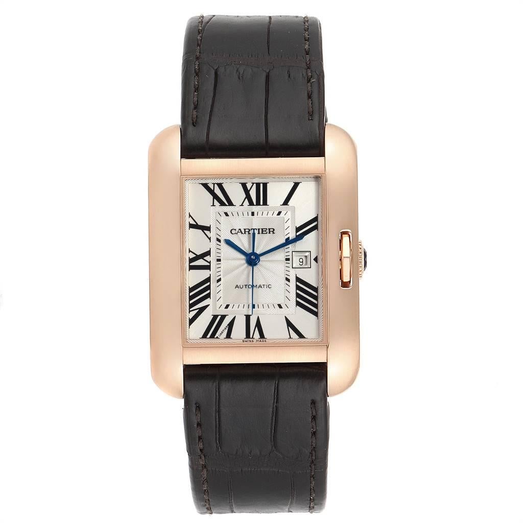 Cartier Tank Anglaise Rose Gold Brown Strap Ladies Watch W5310005. Automatic self-winding movement. 18K rose gold case 39 x 30 mm. Circular grained crown set with the blue sapphire. Scratch resistant sapphire crystal. Silver guilloche dial with