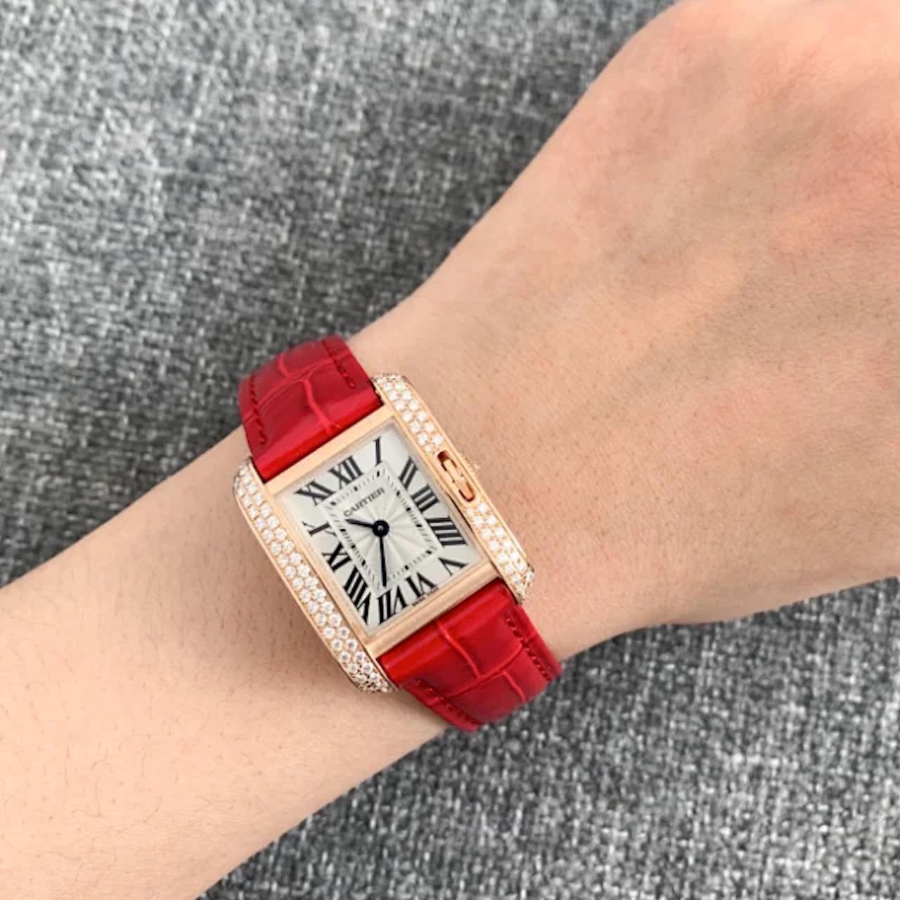 18K pink gold set with diamonds case with a claret alligator leather strap. Fixed bezel. Silvered flinque dial with blued steel hands and Roman numeral hour markers. Minute markers around the inner rim. Dial Type: Analog. Quartz movement.