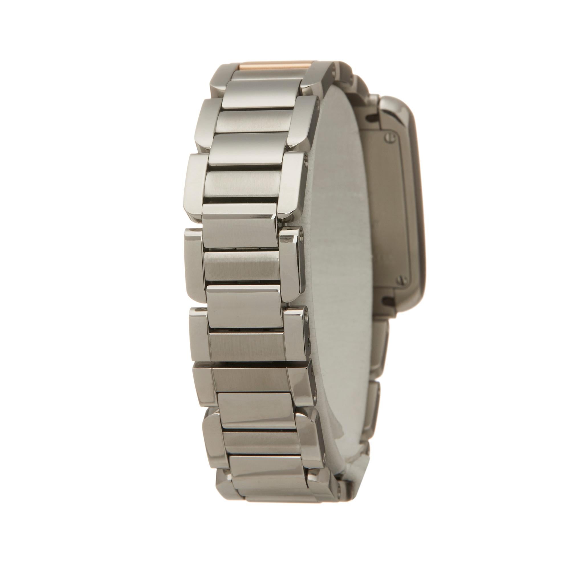 small cartier tank on wrist