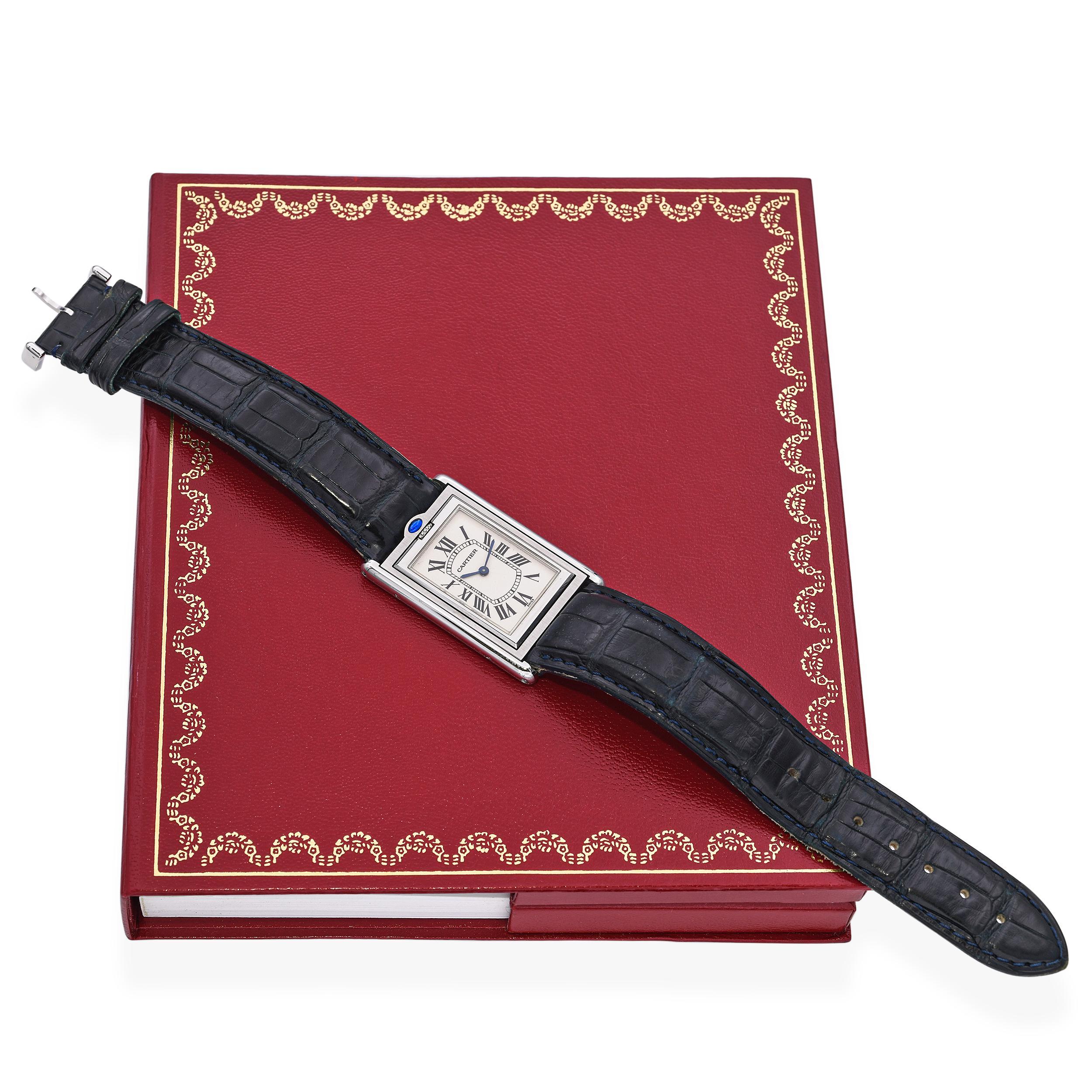 The Cartier Tank Basculante, first introduced in 1932, is admired for its rare reversible case design. This reference 2390 features a manual-wind movement housed in a stainless steel frame with Cartier’s signature Roman numeral dial, blued steel