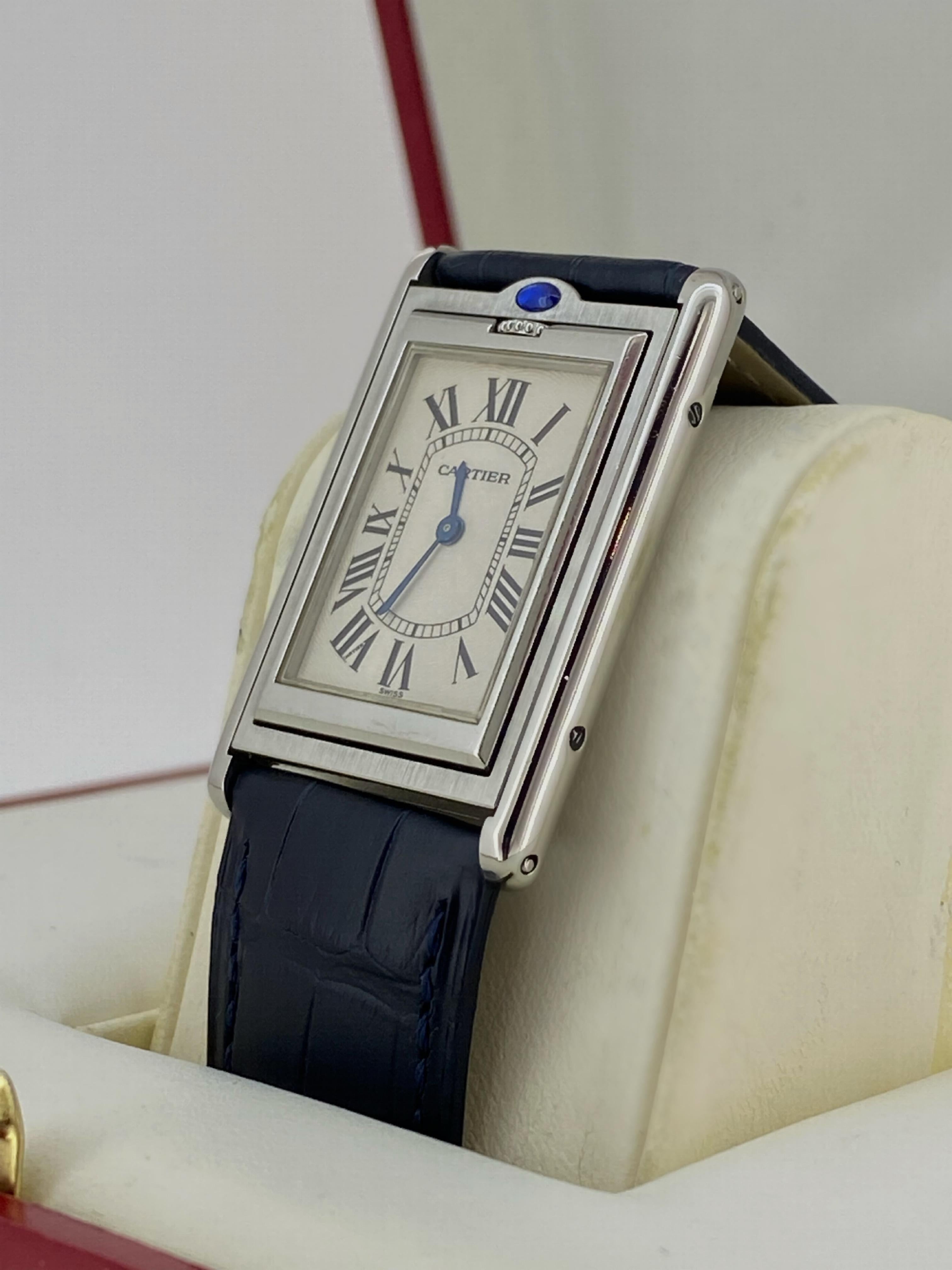 Inspired by the Renault FT-17 tanks, Cartier Tank Wristwatches are iconic & instantly recognizable timepieces. This particular example is a sophisticated Cartier Tank Basculante reference 2390, seldom encountered & highly desirable. 

With its most
