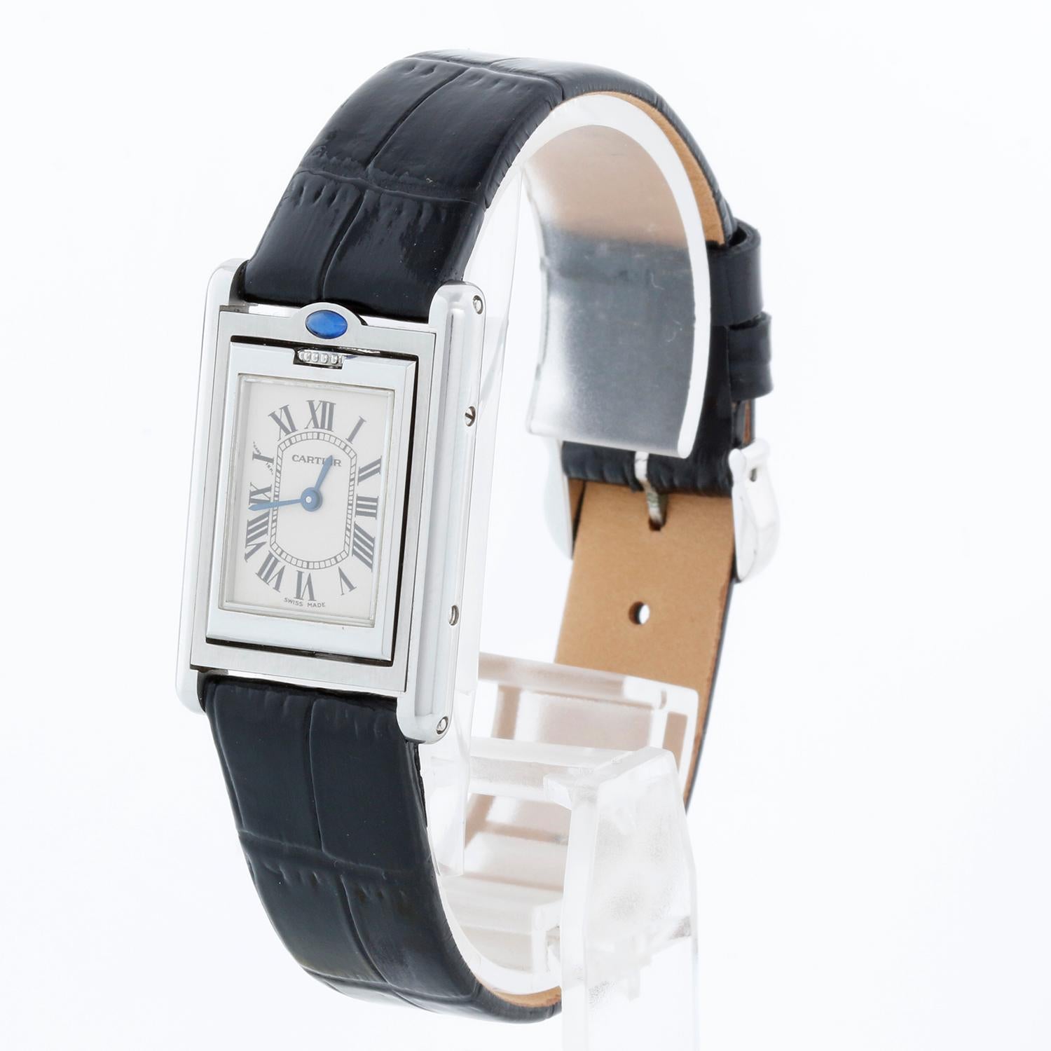 Cartier Tank Basculante Watch Ref 2386 Ladies - Quartz. Stainless steel case ( 22 mm x 36 mm ). Silver dial with Roman numerals. Blue  strap with tang buckle. Pre-owned with custom box.