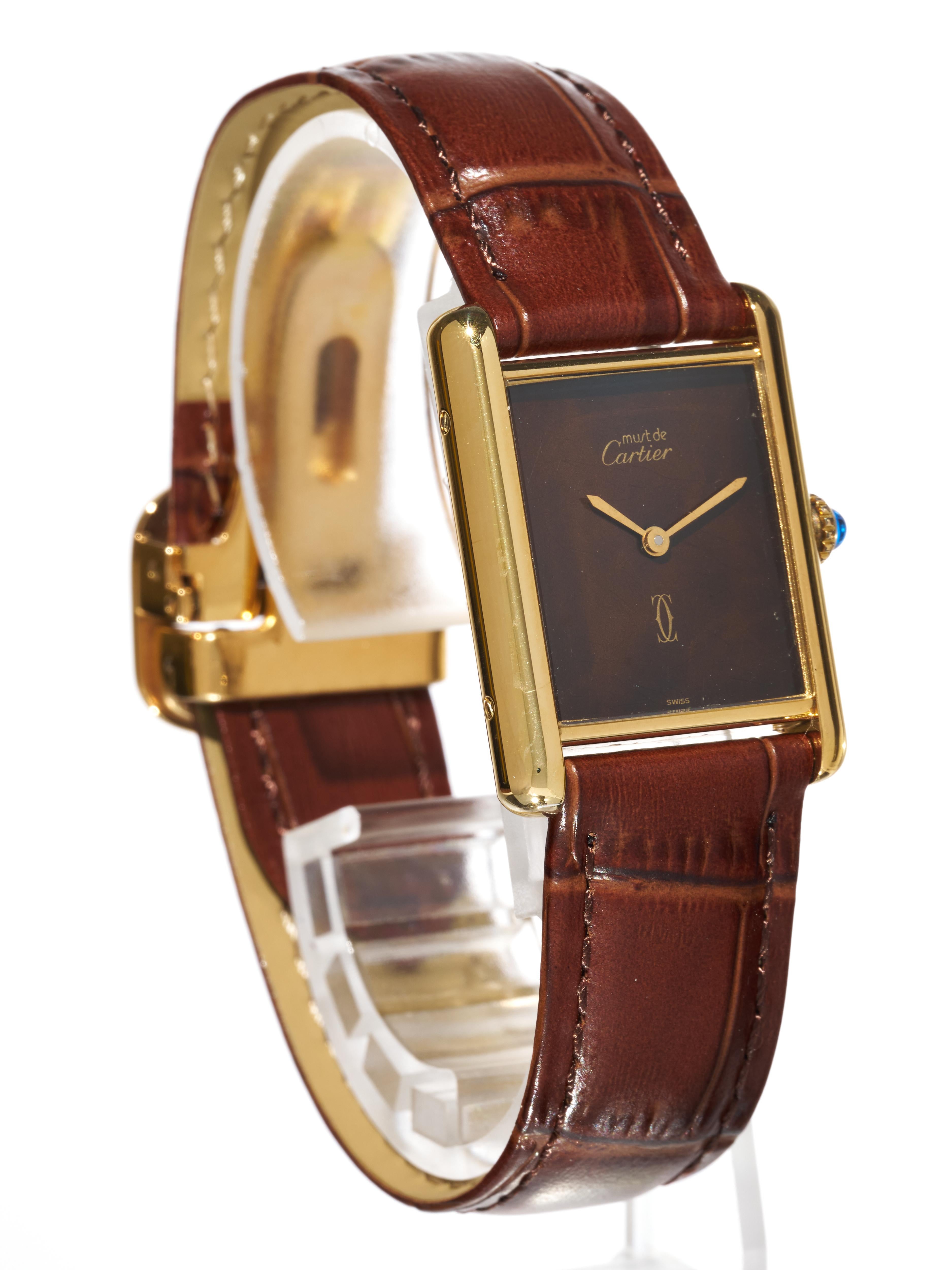 Fork In Time is proud to offer on the 1st Dibs marketplace:
Cartier 
Must De Tank 
Vermeil

18K Yellow Gold Plated 925 Sterling Silver Case
Cartier Stamped & Hallmarked

Vintage Watch 

Circa 1980s 

Burgundy Dial
Gold Sword Hands

The top layer of