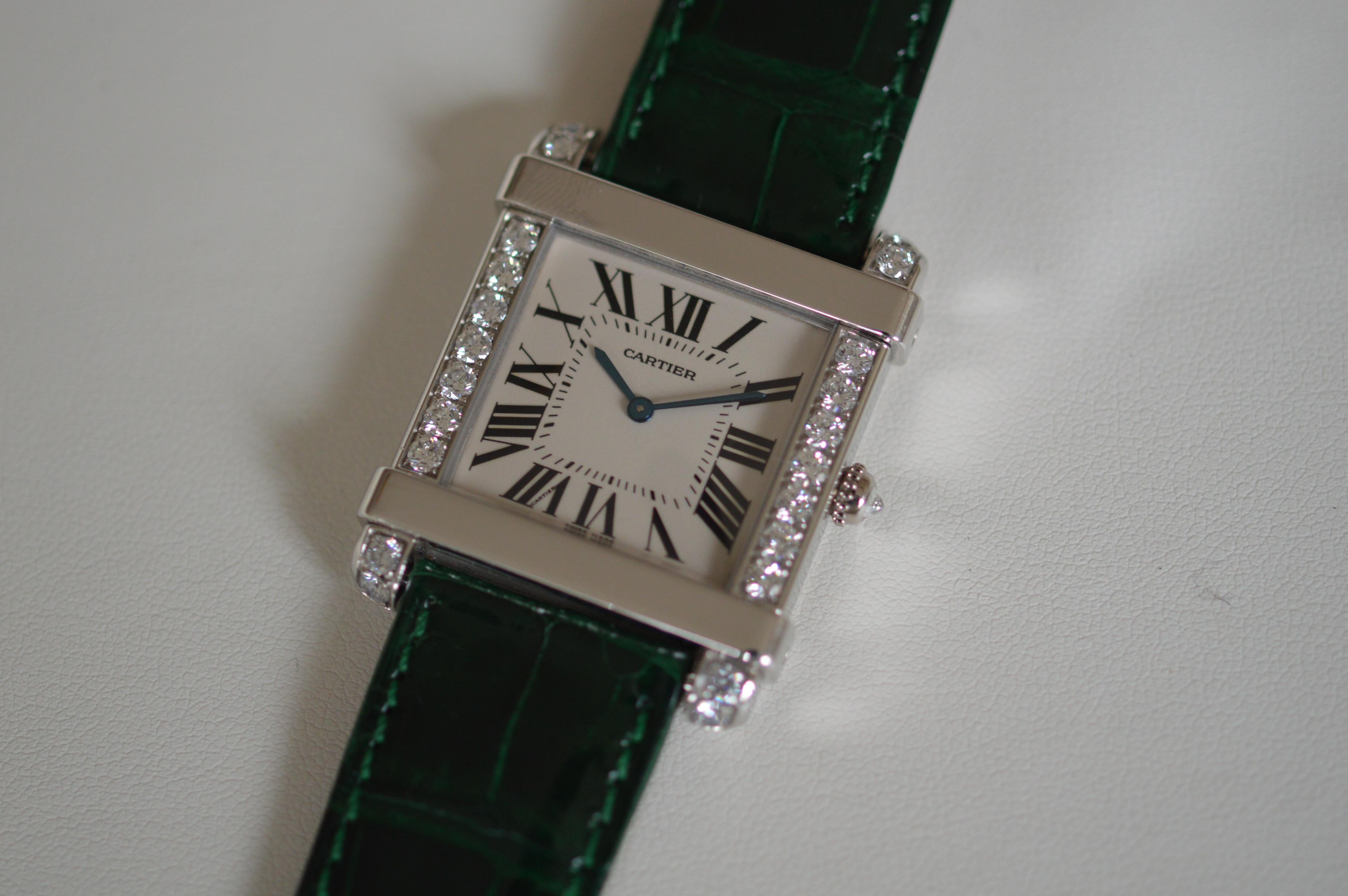 Cartier Tank Chinoise LM Boutique Only item
Very rare item in this condition
Large size
37mm X 30mm
In Platinum case
Green Cartier strap
Reference n° WE300251
Original Cartier Diamond setting
Vertical sides set with 23 Round Diamonds
For a total of