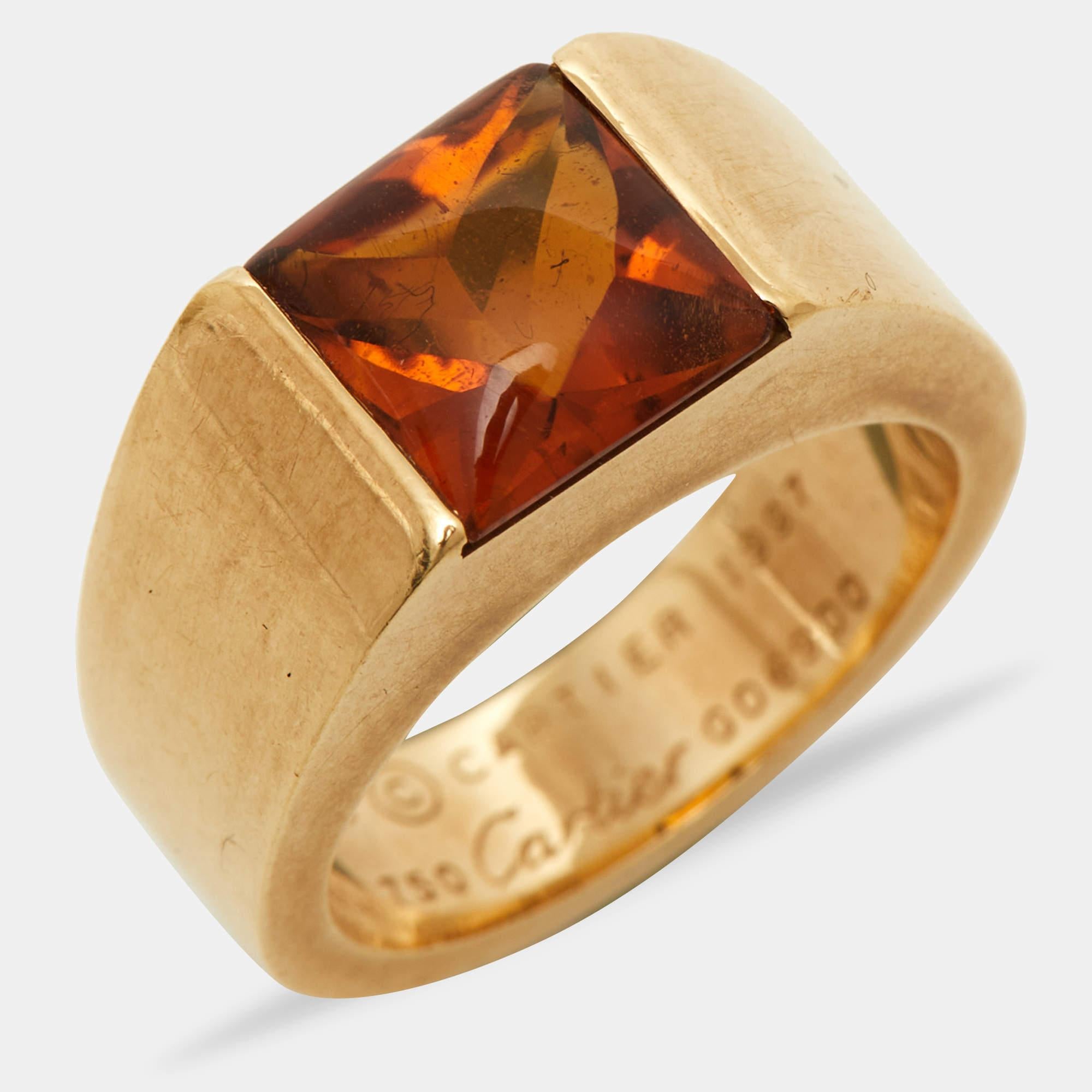 The Cartier Tank Citrine ring is an exquisite jewelry piece. Crafted from luxurious 18k yellow gold, it features a rectangular citrine gemstone with a timeless and elegant tank-inspired design. This ring effortlessly combines classic aesthetics with