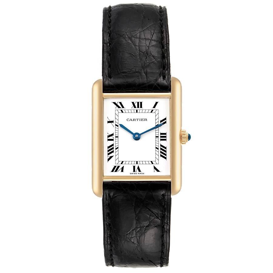 Cartier Tank Classic Paris 18k Yellow Gold Black Strap Unisex Watch. Quartz movement. 18k yellow gold case 23.5 x 30.5 mm. Circular grained crown set with the blue sapphire cabochon. . Mineral glass crystal. White dial with black roman numerals.