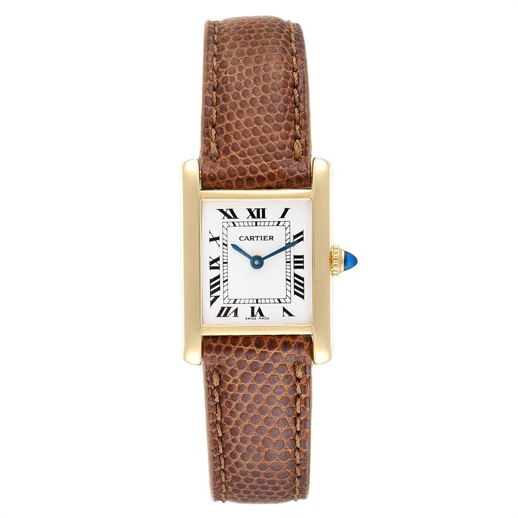 Cartier Tank Classic Paris 18k Yellow Gold Brown Strap Ladies Watch. Quartz movement. Quartz movement. Mineral glass crystal. White dial with black roman numerals. Sword shaped blue hands. Brown leather strap with deployent buckle. Presentation