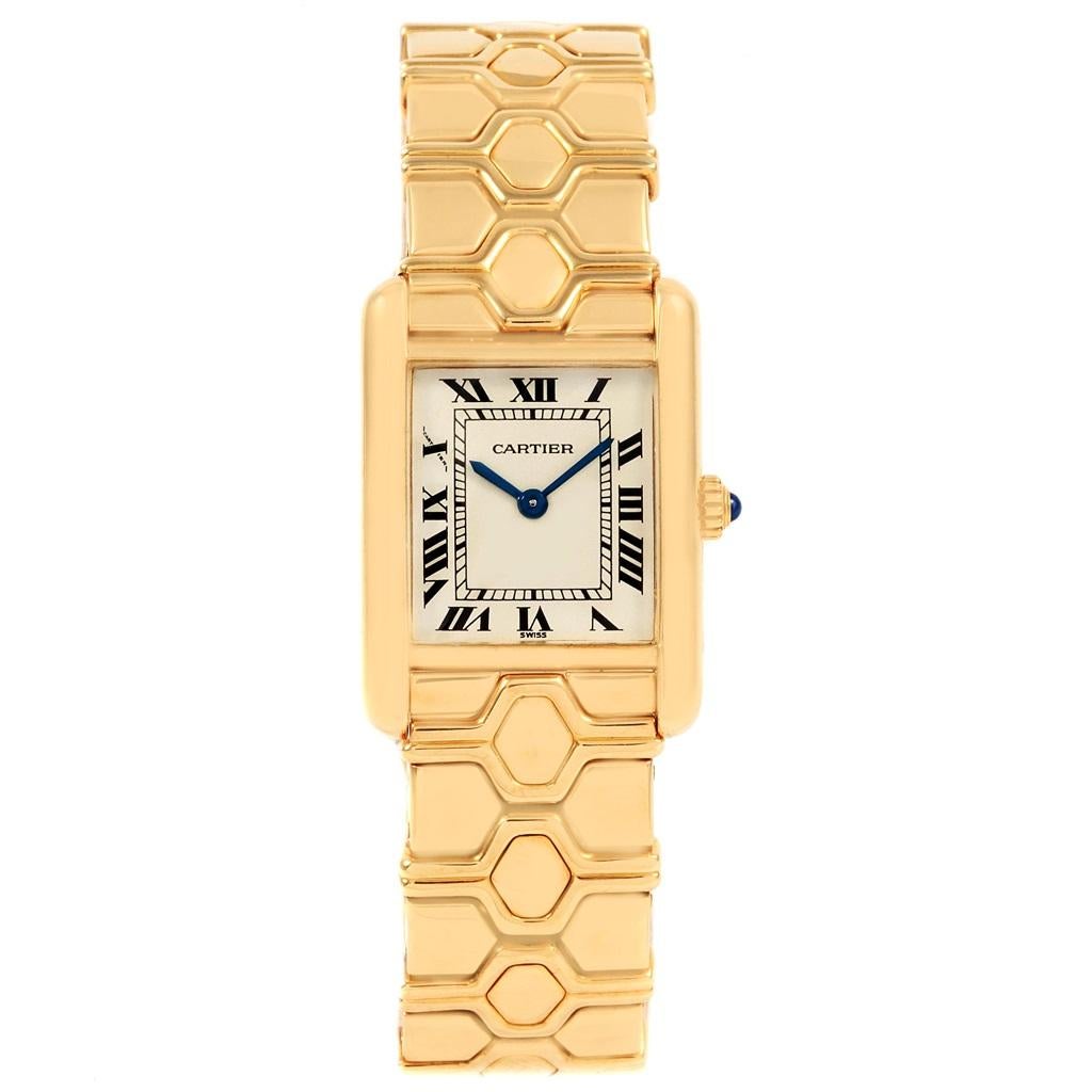 Cartier Tank Classic Paris 18k Yellow Gold Ladies Watch. Quartz movement. 18k yellow gold case 20.0 x 27.0 mm. Circular grained crown set with the blue sapphire cabochon. . Mineral glass crystal. Silver dial with black roman numerals. Sword shaped