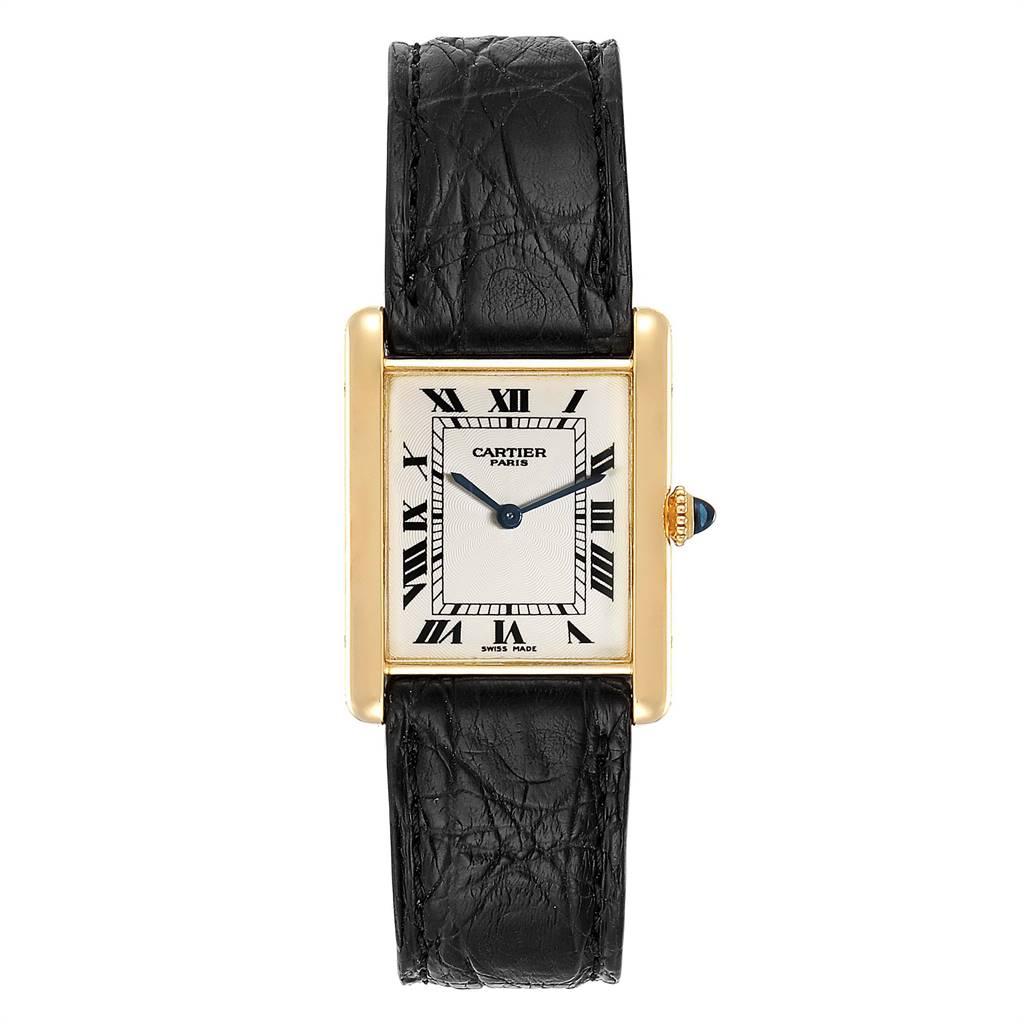 Cartier Tank Classic Paris Yellow Gold Ultra Thin Mechanical Mens Watch. Ultra thin hand made manual winding movement. 18k yellow gold case 23.0 x 30.0 mm. Circular grained crown set with the blue sapphire cabochon. 18K yellow gold bezel. Mineral