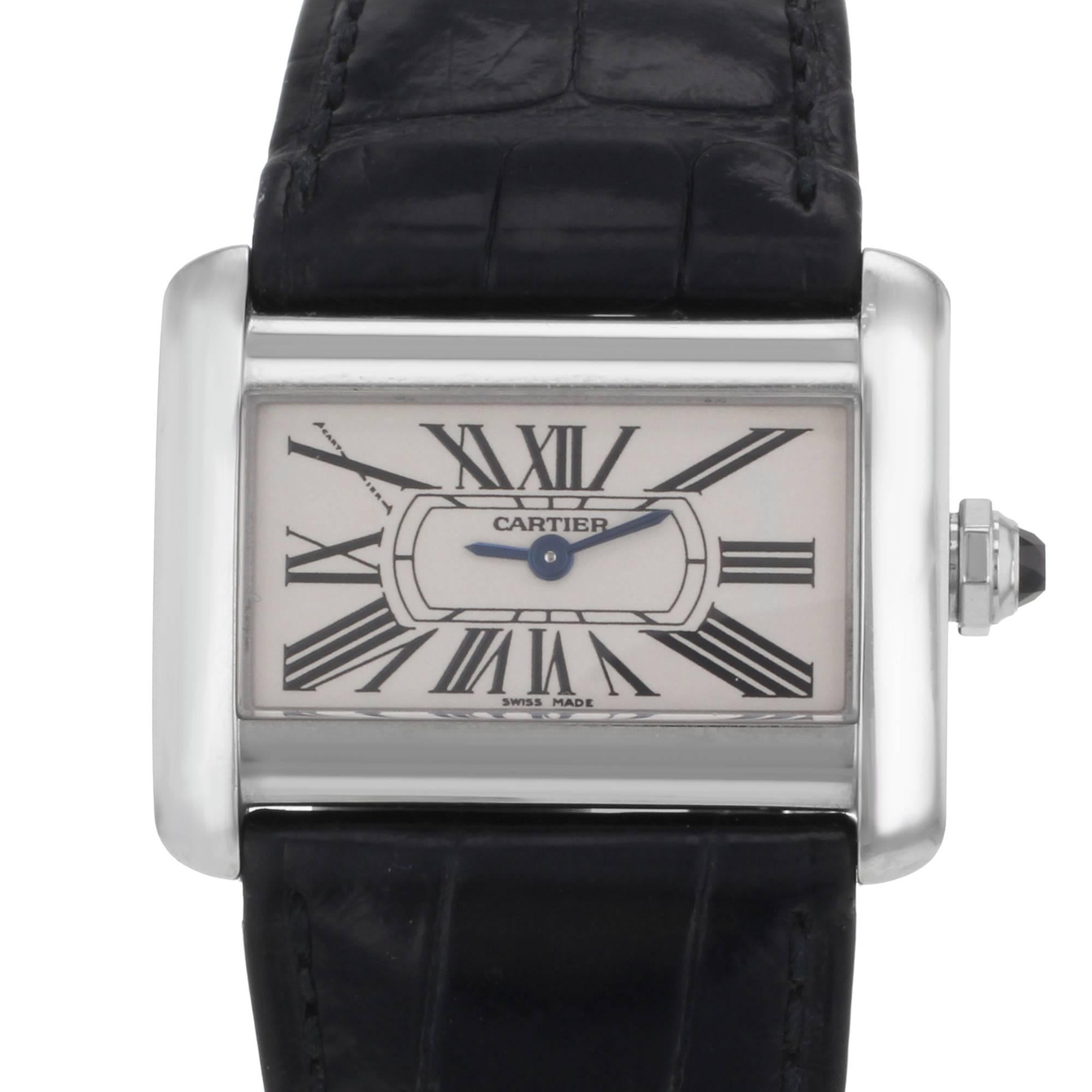This pre-owned Cartier Tank W6300255 is a beautiful Ladies timepiece that is powered by a quartz movement which is cased in a stainless steel case. It has a  rectangle shape face, no features dial and has hand roman numerals style markers. It is