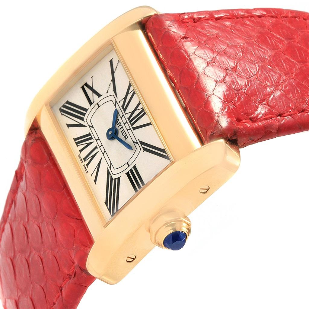 Cartier Tank Divan Mini Yellow Gold Red Strap Ladies Watch W6300356. Quartz movement. 18K yellow gold case 31.5 x 25.0 mm. Circular grained crown set with the blue faceted sapphire. 18K yellow gold fixed bezel. Scratch resistant sapphire crystal.