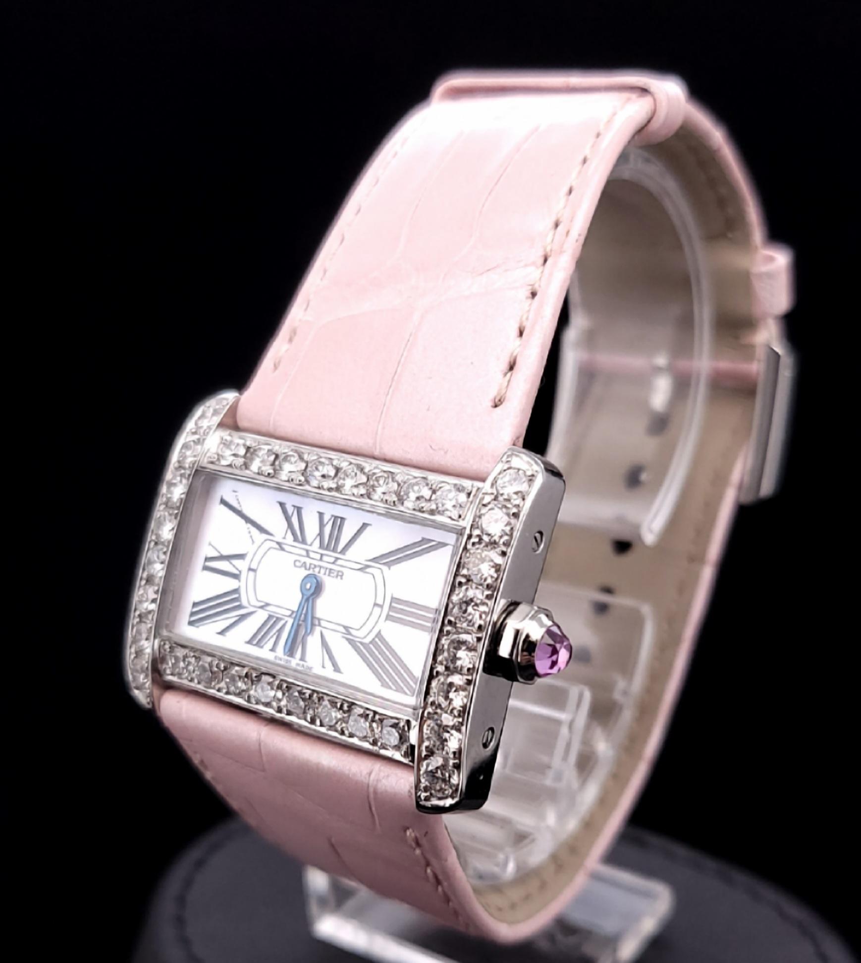 -Mint condition
-Case size: 25x31mm
-Stainless steel
-Movement: Quartz
-Roman numeral hour markers
-Pink leather strap
-Aftermarket Diamond Bezel: 2.6ct, E-F color, VS1 clarity
-Comes with Box, no papers