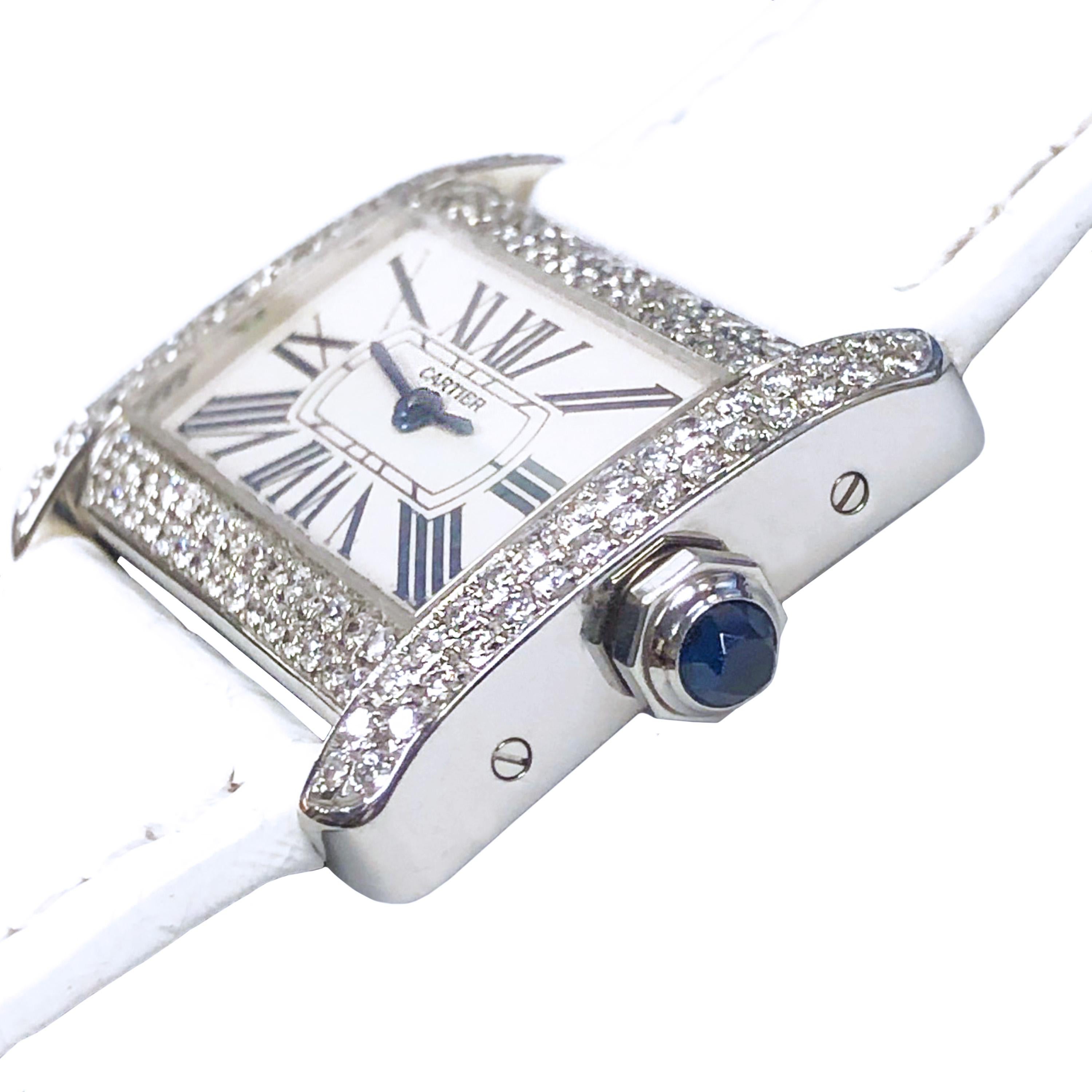 Circa 2015 Cartier Tank Divan Wrist Watch, 31 X 25 MM Stainless Steel Water resistant case. Double Row Diamond Set case totaling 2 Carats. Quartz Movement, White Dial with Black Roman Numerals, Sapphire Crown. Original Cartier White textured Strap