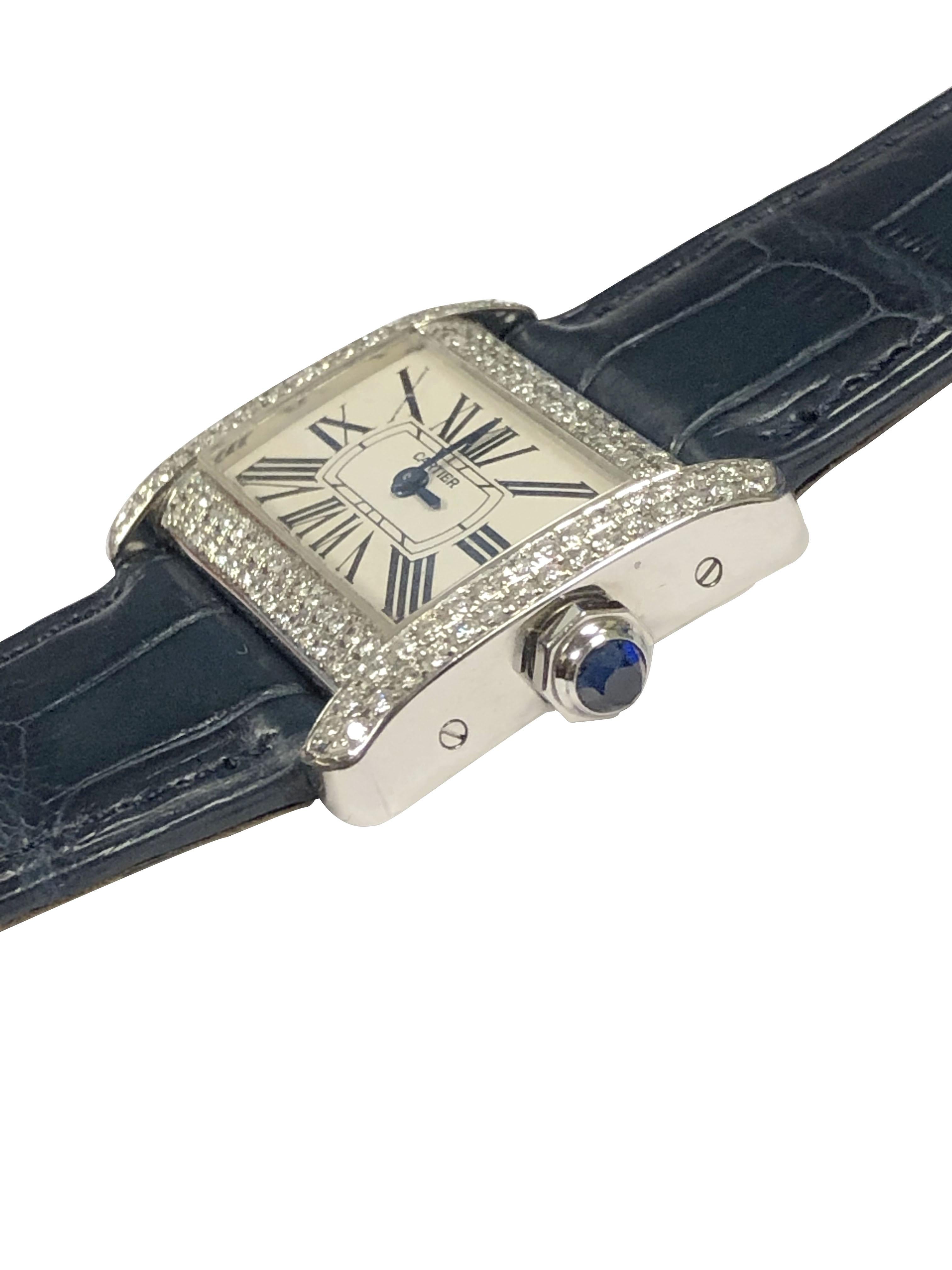 Circa 2015 Cartier Tank Divan Wrist Watch, 31 X 25 MM Stainless Steel Water resistant case. Double Row Diamond Set case totaling 2 Carats. Quartz Movement, White Dial with Black Roman Numerals, Sapphire Crown. Original Cartier White textured Strap