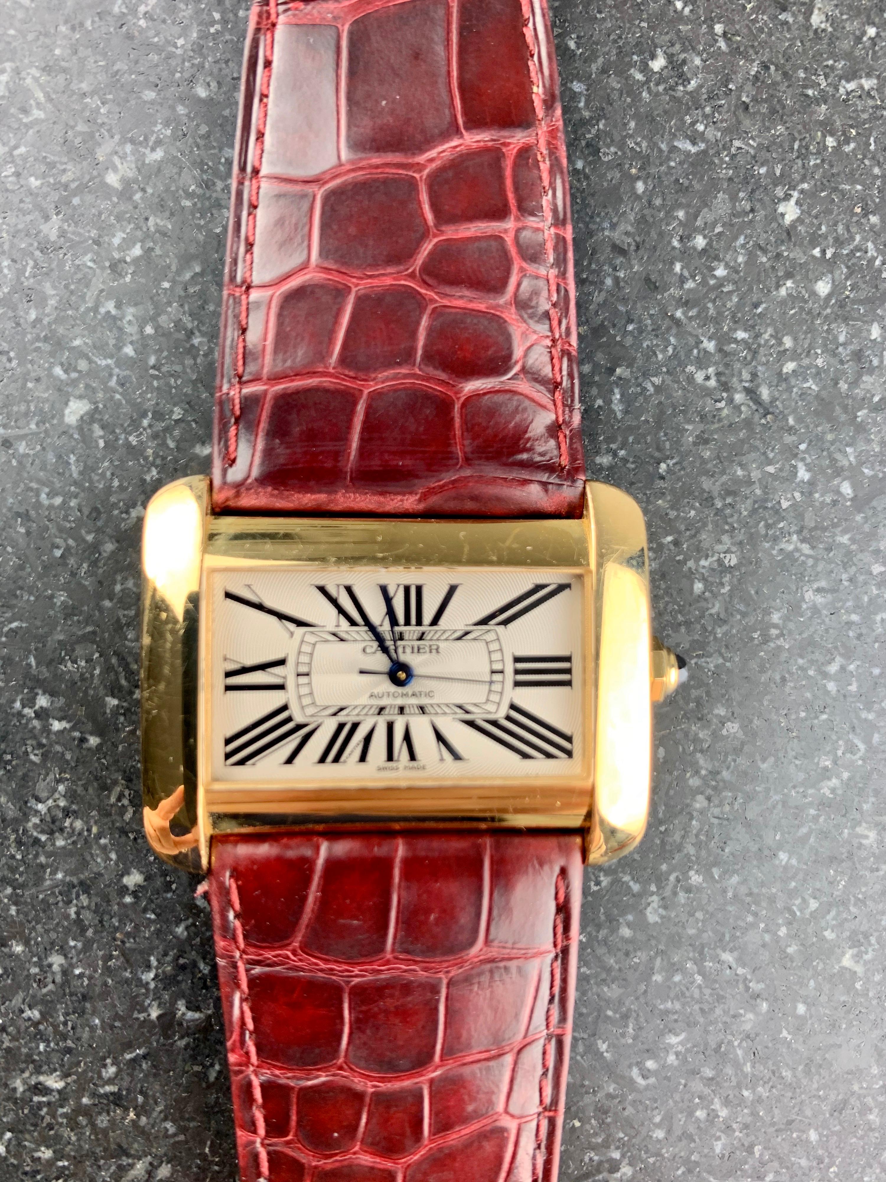 Cartier Tank Divan XL Ref. 2603 18 Carat Yellow Gold 38 mm Automatic Watch. 
Champagne Dial With Black Roman Numerals And Blue Steel Hands. 18 Carat Gold Case And Buckle With Sapphire Crystal. Case Size 30 mm x 38 mm. Water Resistant. Original
