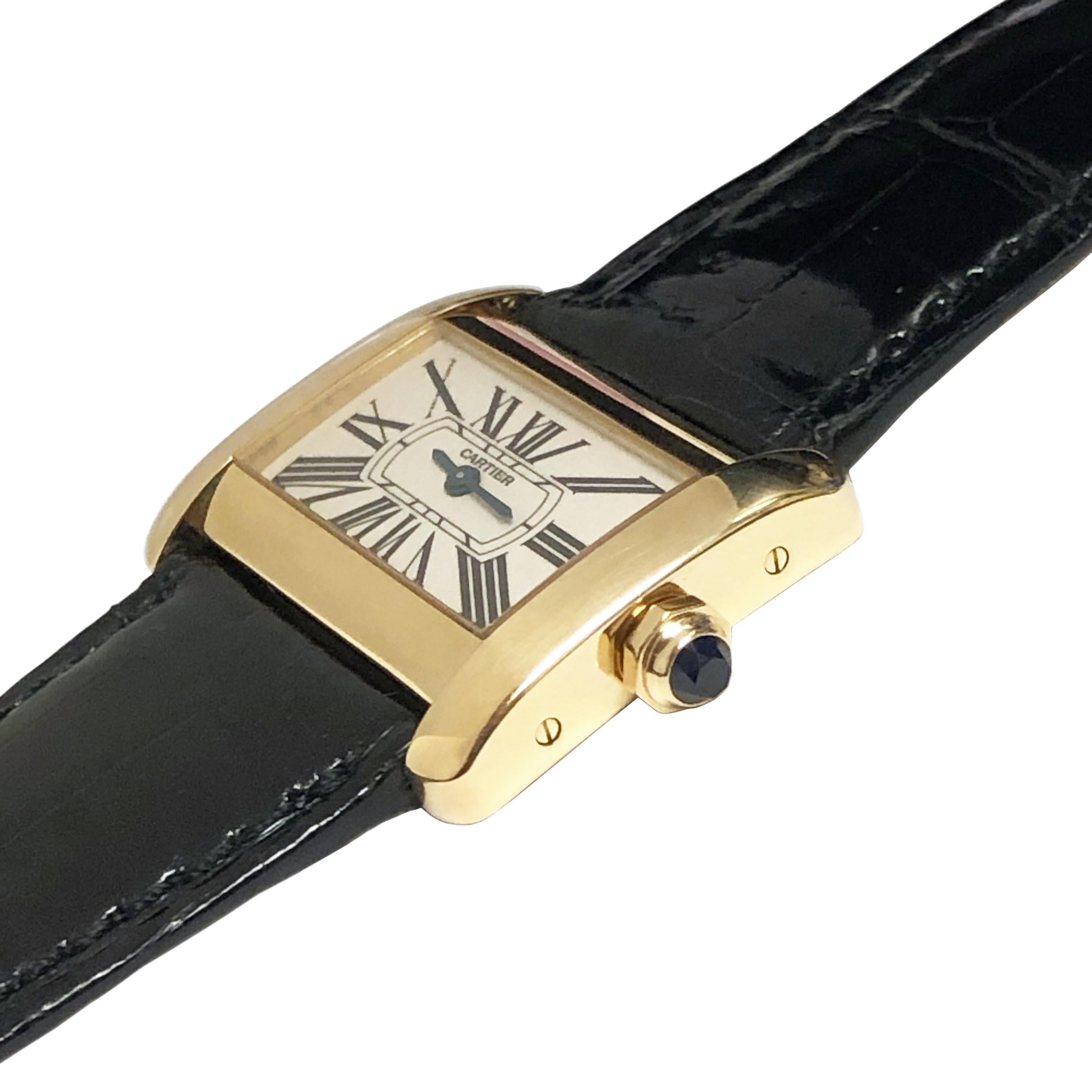 Circa 2005 Cartier Tank Divan Wrist watch, 31 X 25 M.M. 18K yellow Gold Water resistant case, Quartz movement, white dial with Black Roman numerals and a Sapphire crown. New, Cartier Black Croco strap with original Cartier 18K Gold tang buckle,
