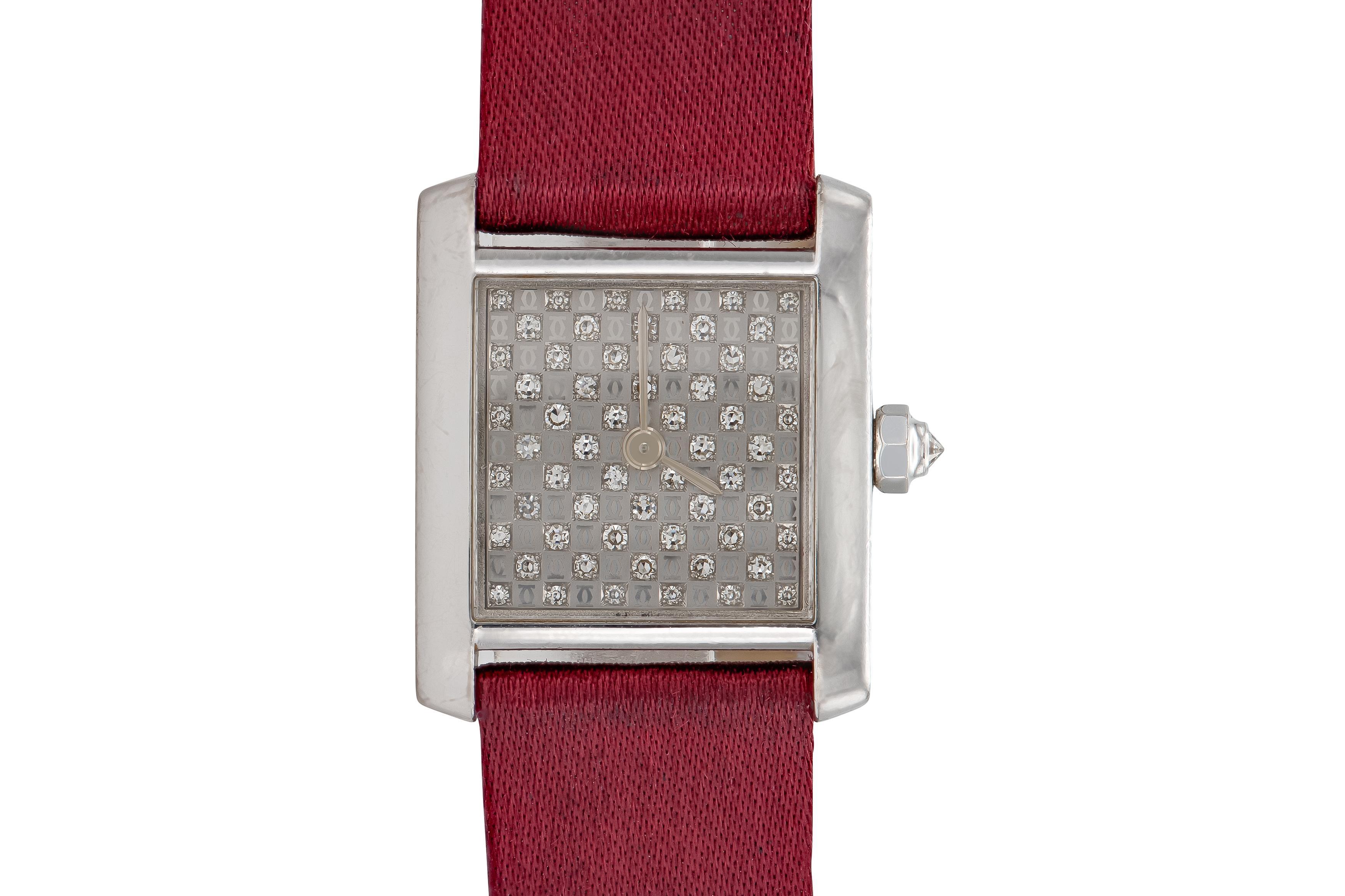 Finely crafted in 18k white gold with a double C logo face featuring small Round brilliant cut Diamonds, and a burgundy satin strap.
Signed by Cartier
20mm face
Model #2517