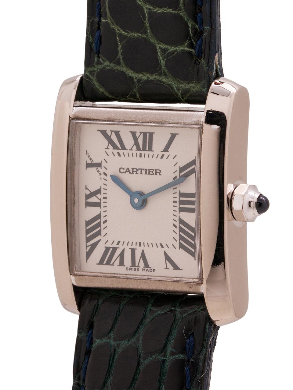 
Cartier 18K WG Tank Francaise 20 X 25 mm classic lady’s model on strap with 18K WG Cartier tang buckle. Featuring classic silvered parchment dial with  black printed Roman numerals and blued steel hand and with sapphire cabachon crown. Battery