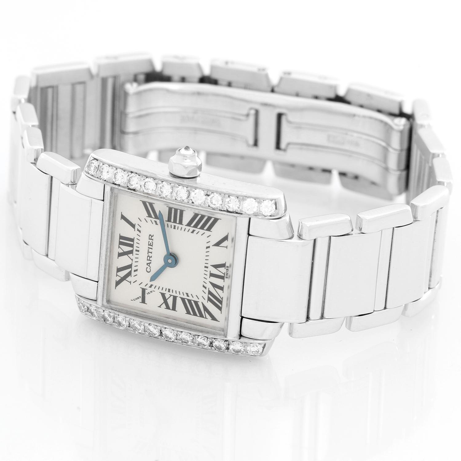 Cartier Tank Francaise 18k White Gold & Diamonds Ladies Watch WE1002S3 -  Quartz. 18k white gold case with factory diamond bezel (20mm x 25mm). Ivory colored dial with black Roman numerals. 18k white gold Cartier bracelet with deployant clasp.