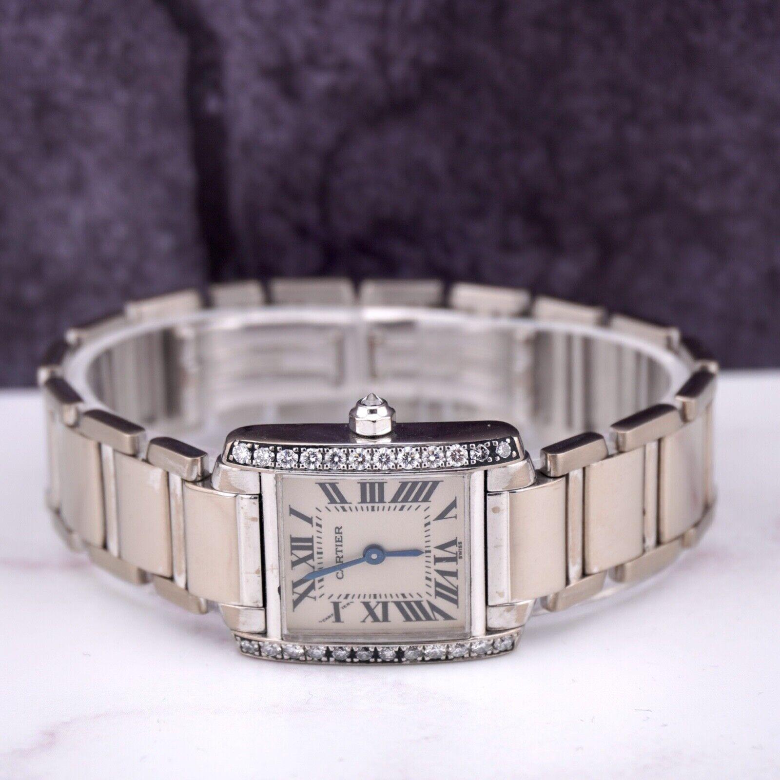 Cartier Tank Francaise 30mm Watch. A Pre-owned watch w/ Gift Box. Watch is 100% Authentic and Comes with Authenticity Card. Watch Reference is 2403 and is in Good Condition (See Pictures). The dial color is While is and material is 18k White Gold.