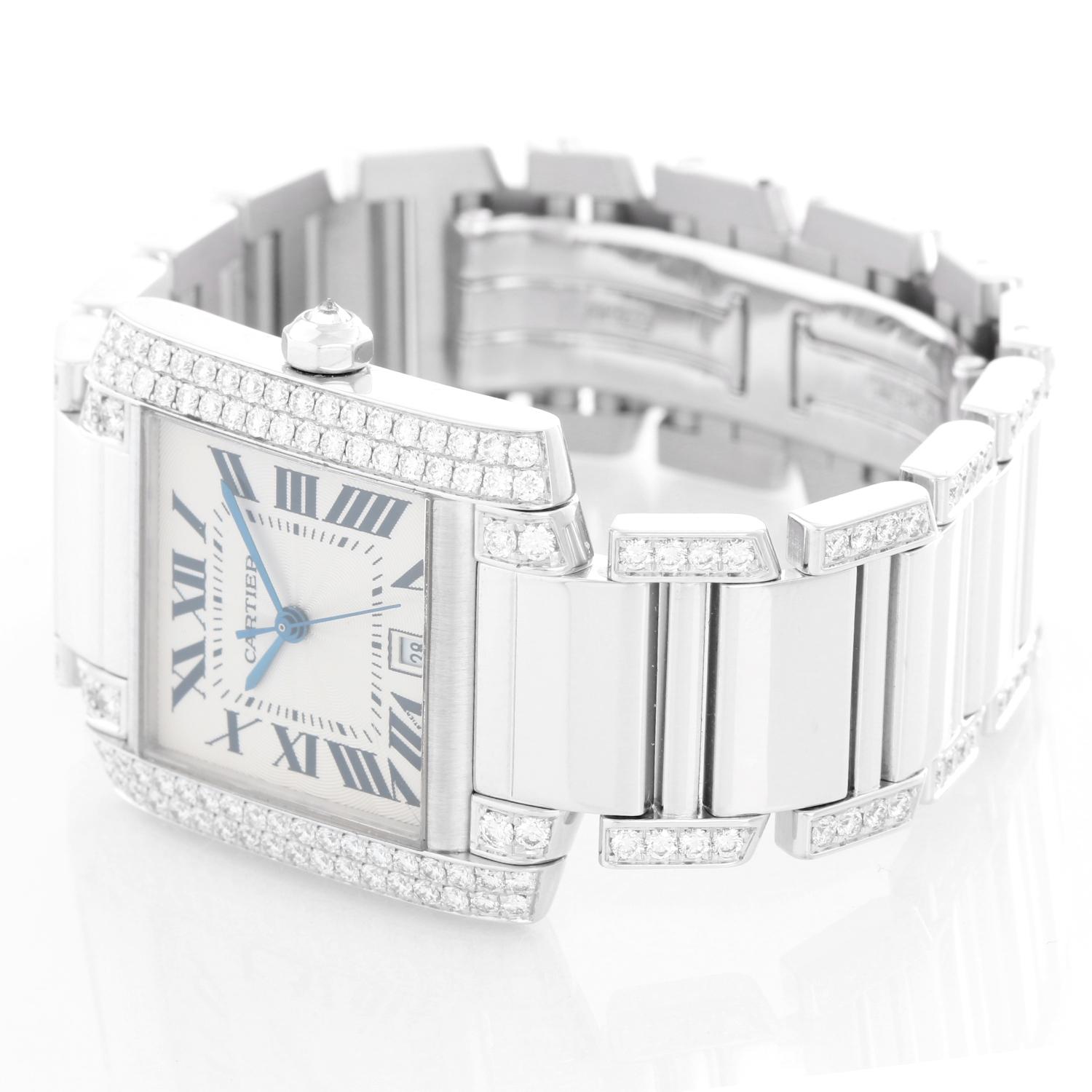 Cartier Tank Francaise 18k White Gold Mens Watch WE1003SF - Automatic winding . 18K White gold case with diamonds (28 mm x 32 mm ). Ivory colored dial with black Roman numerals; date at 5 o'clock. 18K White gold Cartier diamond bracelet; will fit a