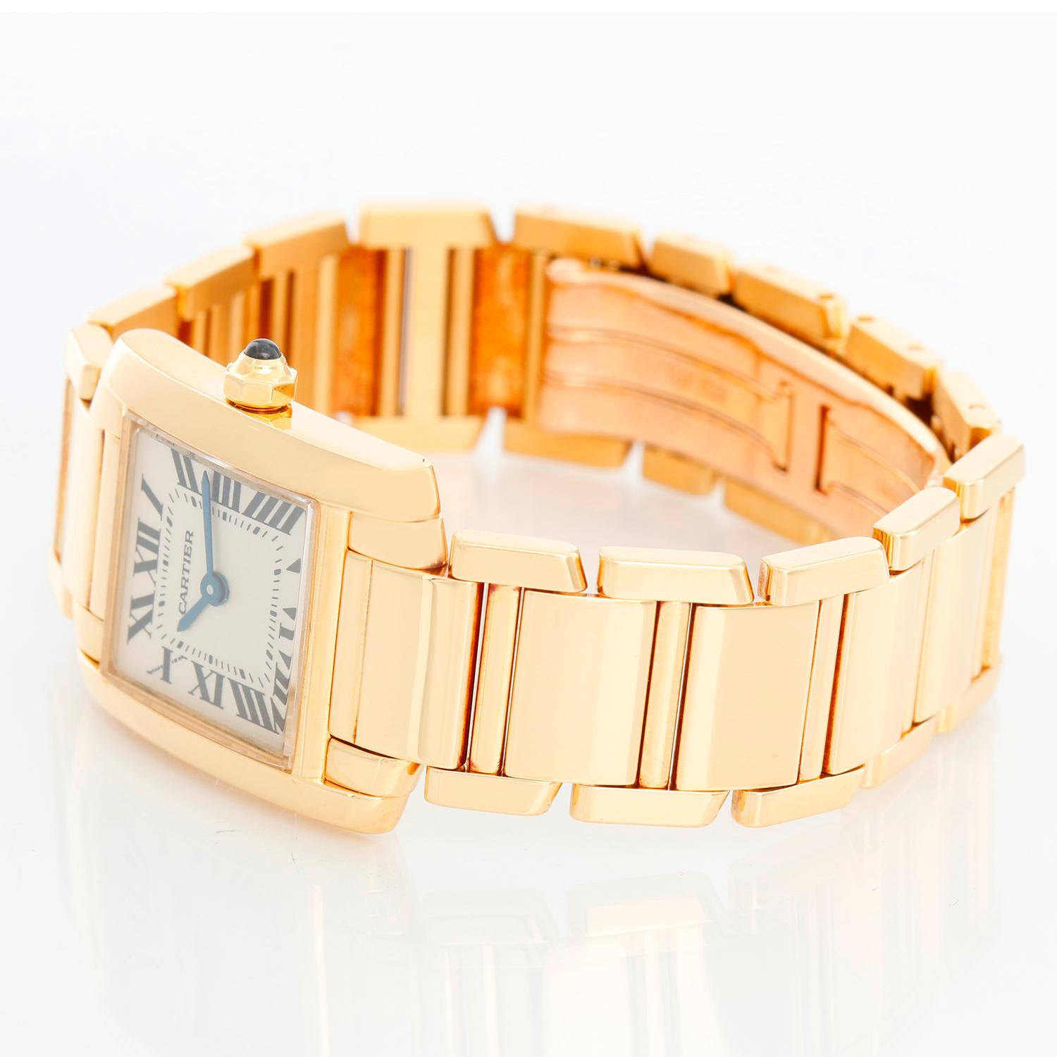 Cartier Tank Francaise 18k Yellow Gold Ladies Watch 1820 - Quartz. 18k yellow gold  case (20mm x 25mm). Ivory colored dial with black Roman numerals. 18k yellow gold Cartier Tank Francaise bracelet. Pre-owned with custom box.

All watches measure to