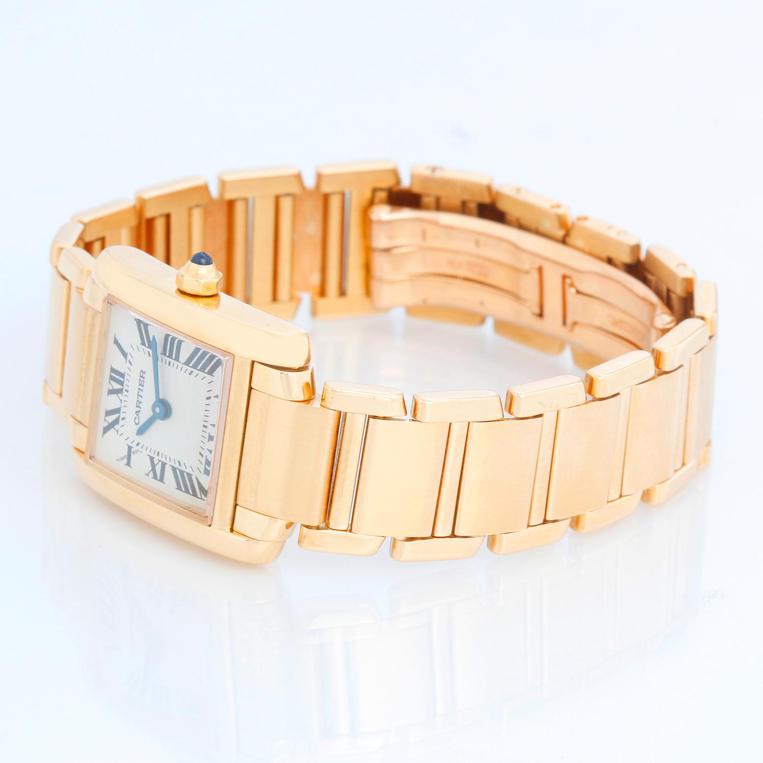 Cartier Tank Francaise 18k Yellow Gold Ladies Watch 2385 - Quartz. 18k yellow gold  case (20mm x 25mm). Ivory colored dial with black Roman numerals. 18k yellow gold Cartier Tank Francaise bracelet. Pre-owned with custom box.