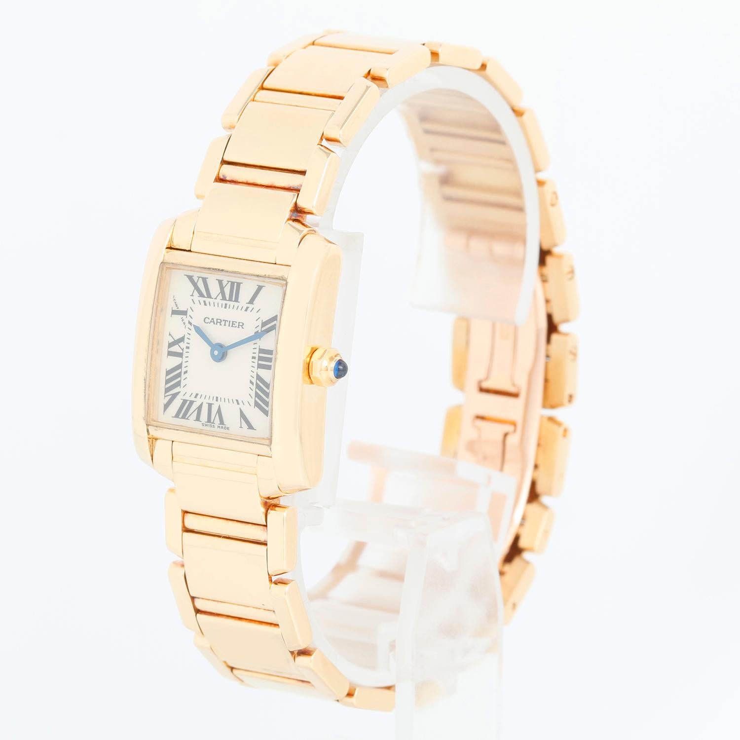 Cartier Tank Francaise 18k Yellow Gold Ladies Watch 2385 W50002N2 - Quartz. 18k yellow gold  case (20mm x 25mm). Ivory colored dial with black Roman numerals. 18k yellow gold Cartier Tank Francaise bracelet; fits a 6.5 inch wrist. Pre-owned with