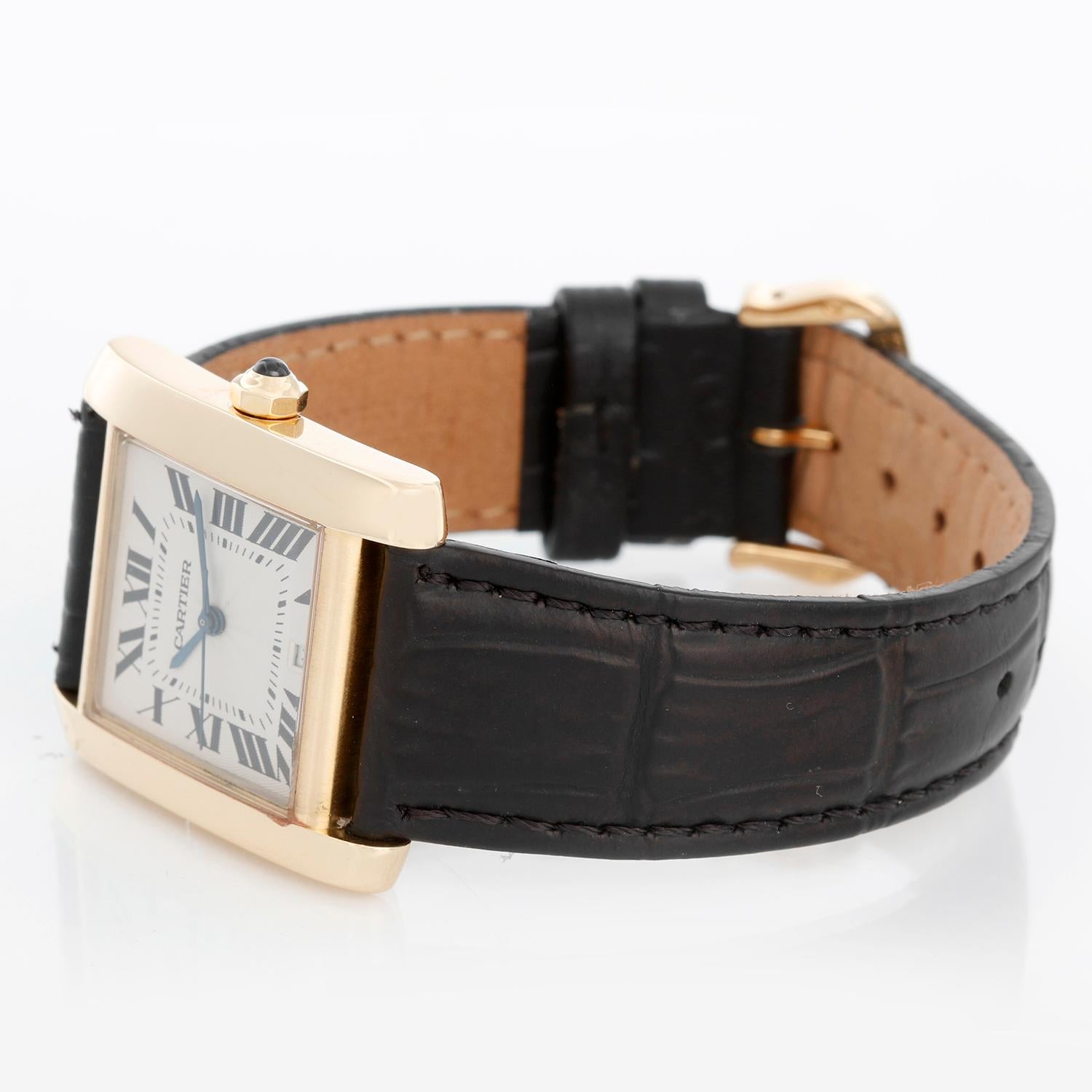 Cartier Tank Francaise 18k Yellow Gold Men's Watch W5000156 1840 - Automatic winding; date. 18k yellow gold case (28 x 32mm ). Silver guilloche dial with black Roman numerals. Black Cartier strap with 18K yellow gold Cartier deployant clasp .