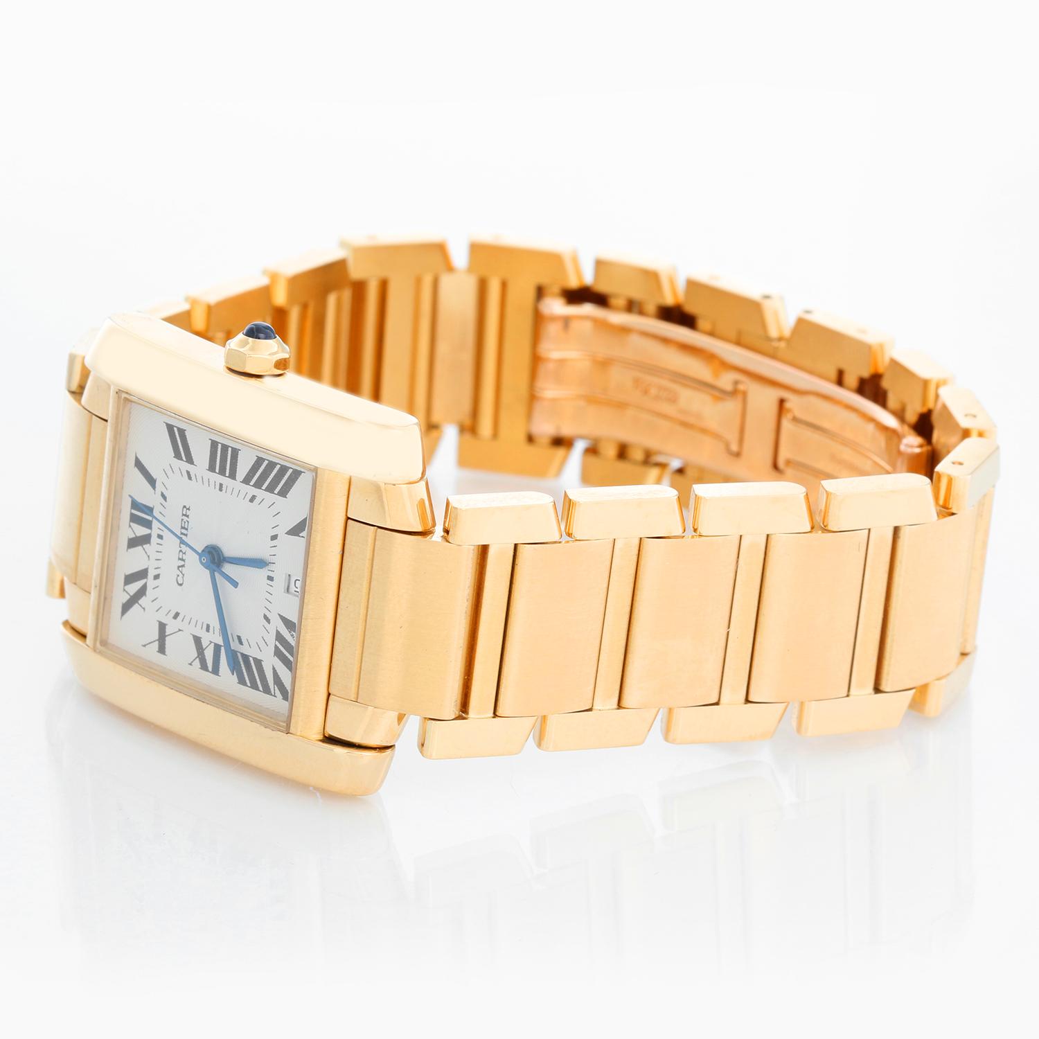 Cartier Tank Francaise 18k Yellow Gold Men's Watch W5000156 1840 - Automatic winding; date. 18k yellow gold case (28 x 32mm ). Silver guilloche dial with black Roman numerals. 18K Yellow Gold Bracelet. Pre-owned with Cartier box and books.