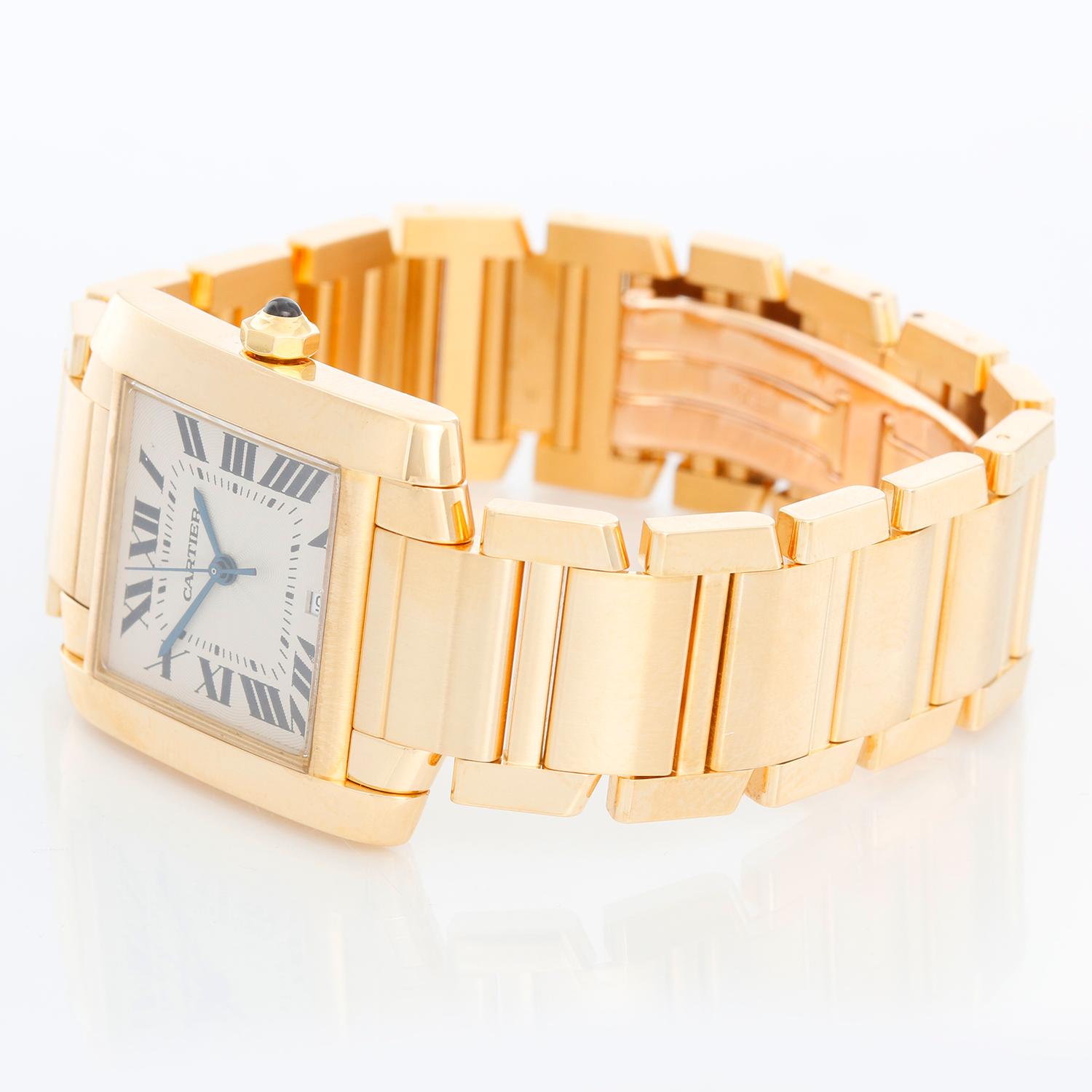 Cartier Tank Francaise 18k Yellow Gold Watch W5000156 1840 - Automatic winding; date. 18k yellow gold case (28mm x 33mm). Silver guilloche dial with black Roman numerals. 18K Yellow gold bracelet. Pre-owned with Cartier box with books. 