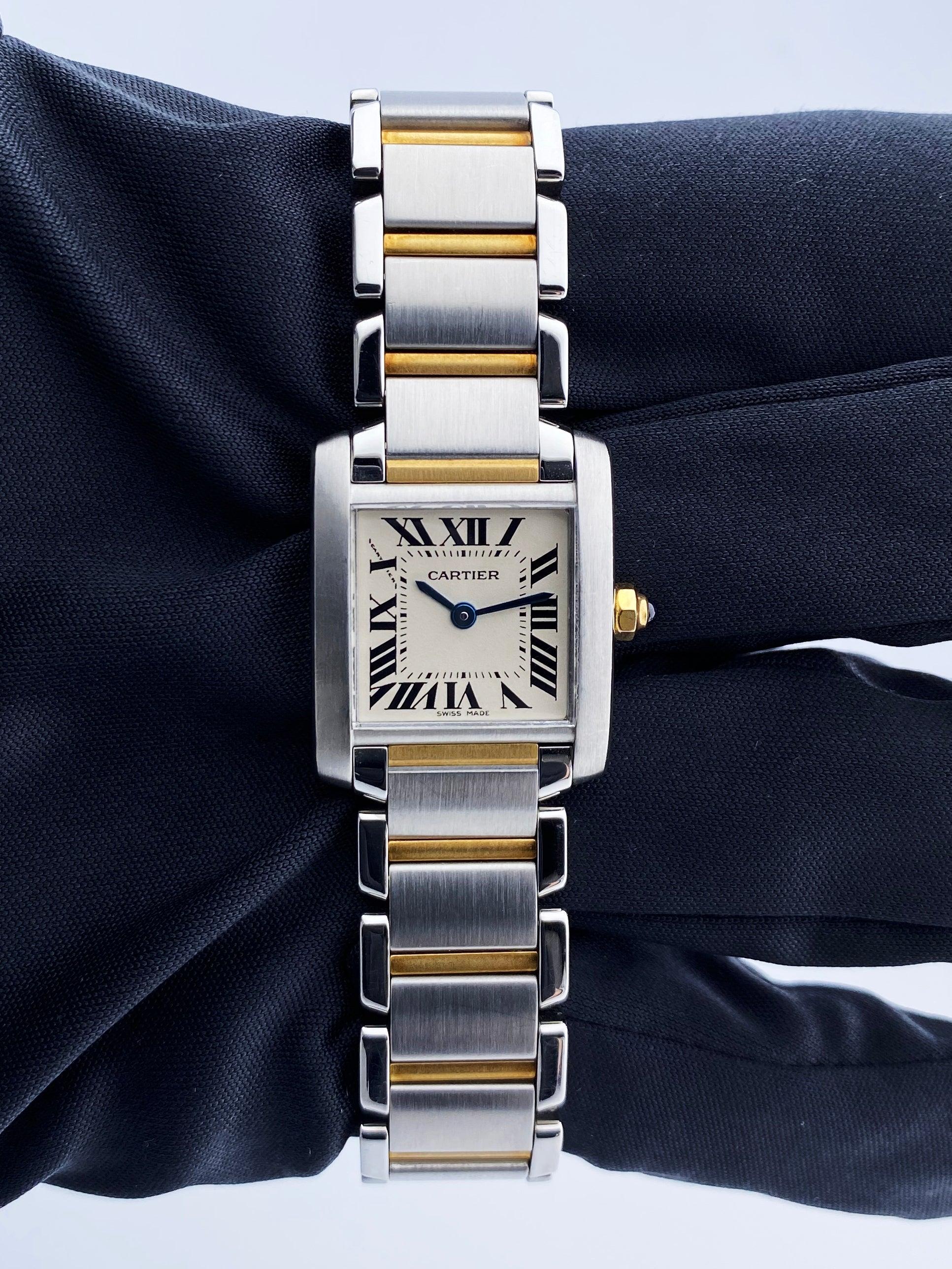 
Cartier Tank Francaise 2300 Ladies Watch. 20mm Stainless steel case. Stainless steel smooth bezel. Off-White dial with blue steel hands and Roman numeral hour markers. Minute markers on the inner dial. Stainless steel & 18K yellow gold bracelet