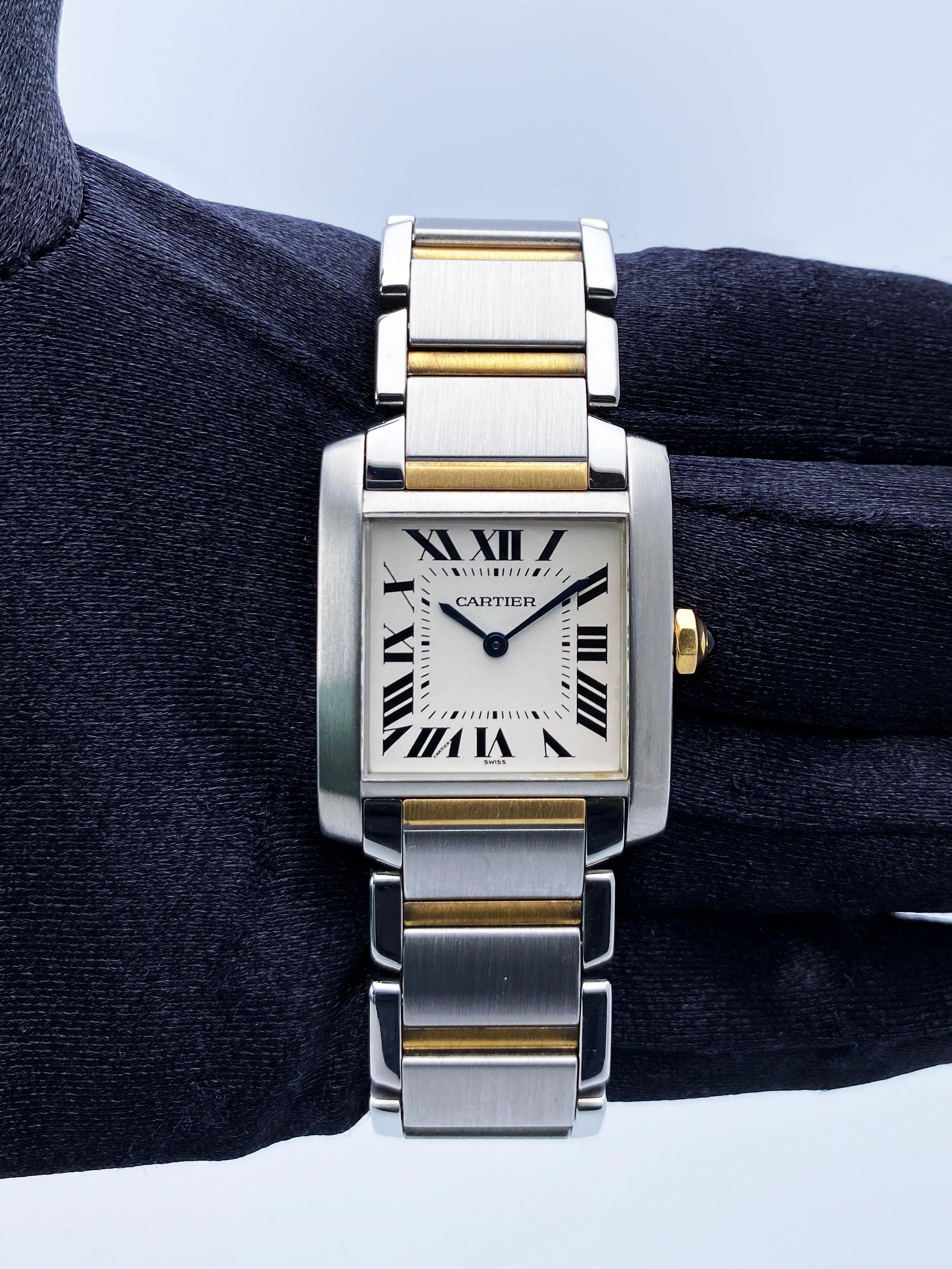 Cartier Tank Francaise 2301 Watch. 25mm stainless steel case with smooth bezel. Off-White dial with blue steel hands and black Roman numeral hour markers. Minute markers on the inner dial. 18K yellow gold & stainless steel bracelet with stainless