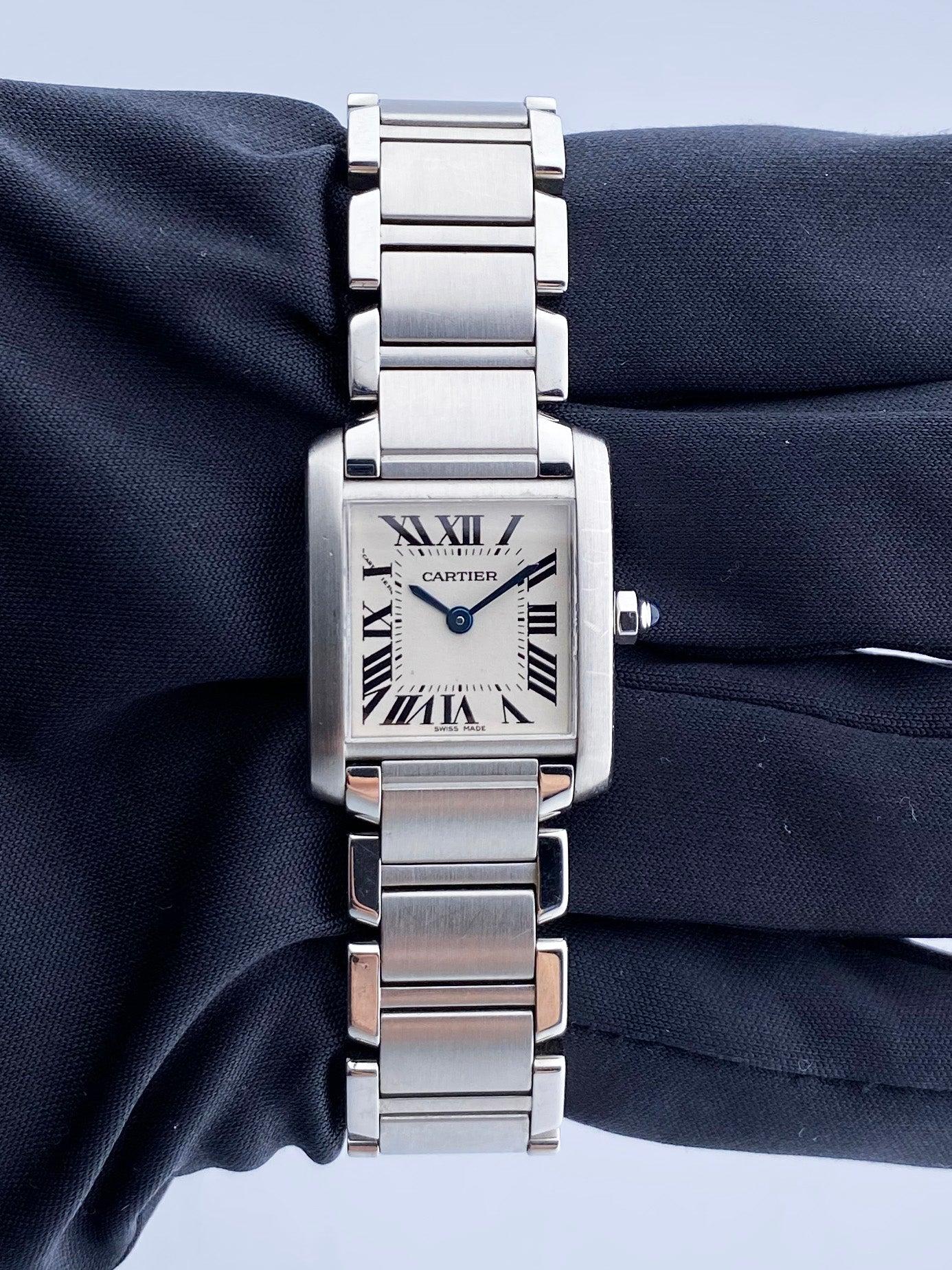 
Cartier Tank Francaise 2384 Ladies Watch. 20mm Stainless Steel case. Stainless Steel smooth bezel. Off-White dial with Blue steel hands and Roman numeral hour markers. Minute markers on the inner dial. Stainless steel bracelet with hidden butterfly