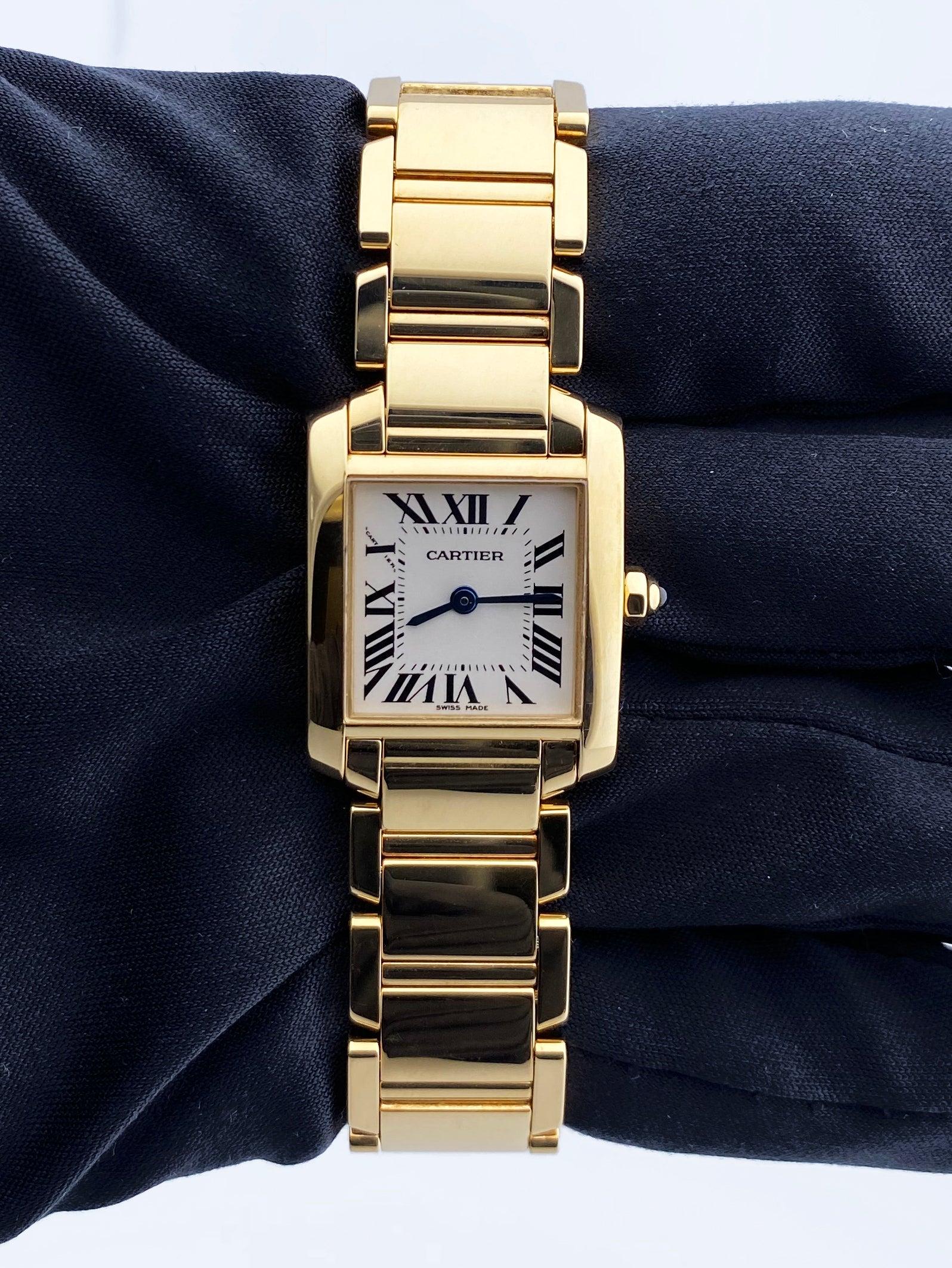 Cartier Tank Francaise 2385 Ladies Watch. 20mm 18k yellow gold case with 18K yellow gold bezel. Off-White dial with Blue steel hands and Roman numeral hour markers. Minute markers on the inner dial. 18K yellow gold bracelet with hidden butterfly.