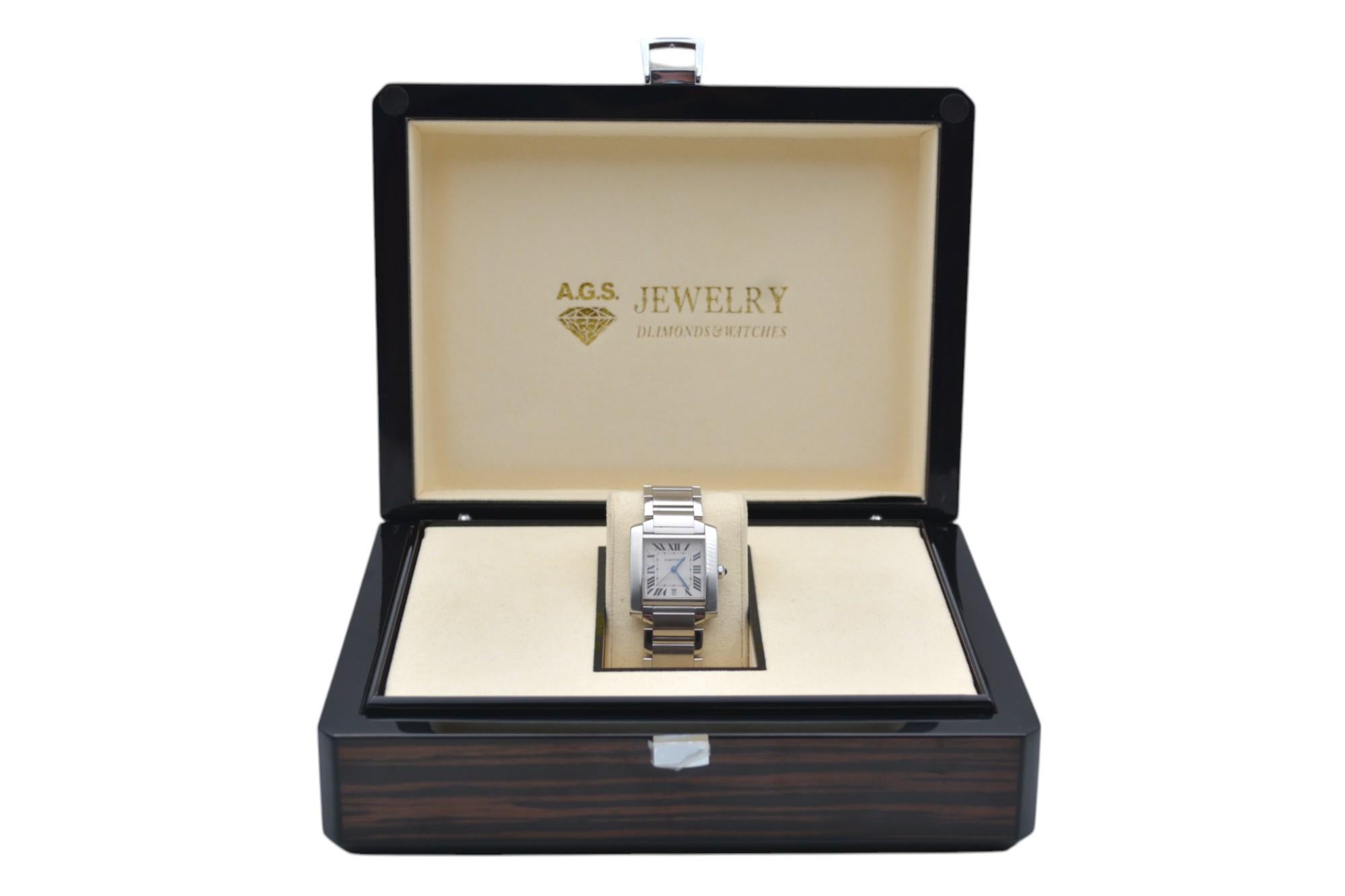 The watch is in a very good condition and it’s working well. It shows slight signs of wear and scratches. The watch comes with an AGS Jewelry wooden box, along with an AGS Jewelry warranty card. For more information about delivery, warranty and