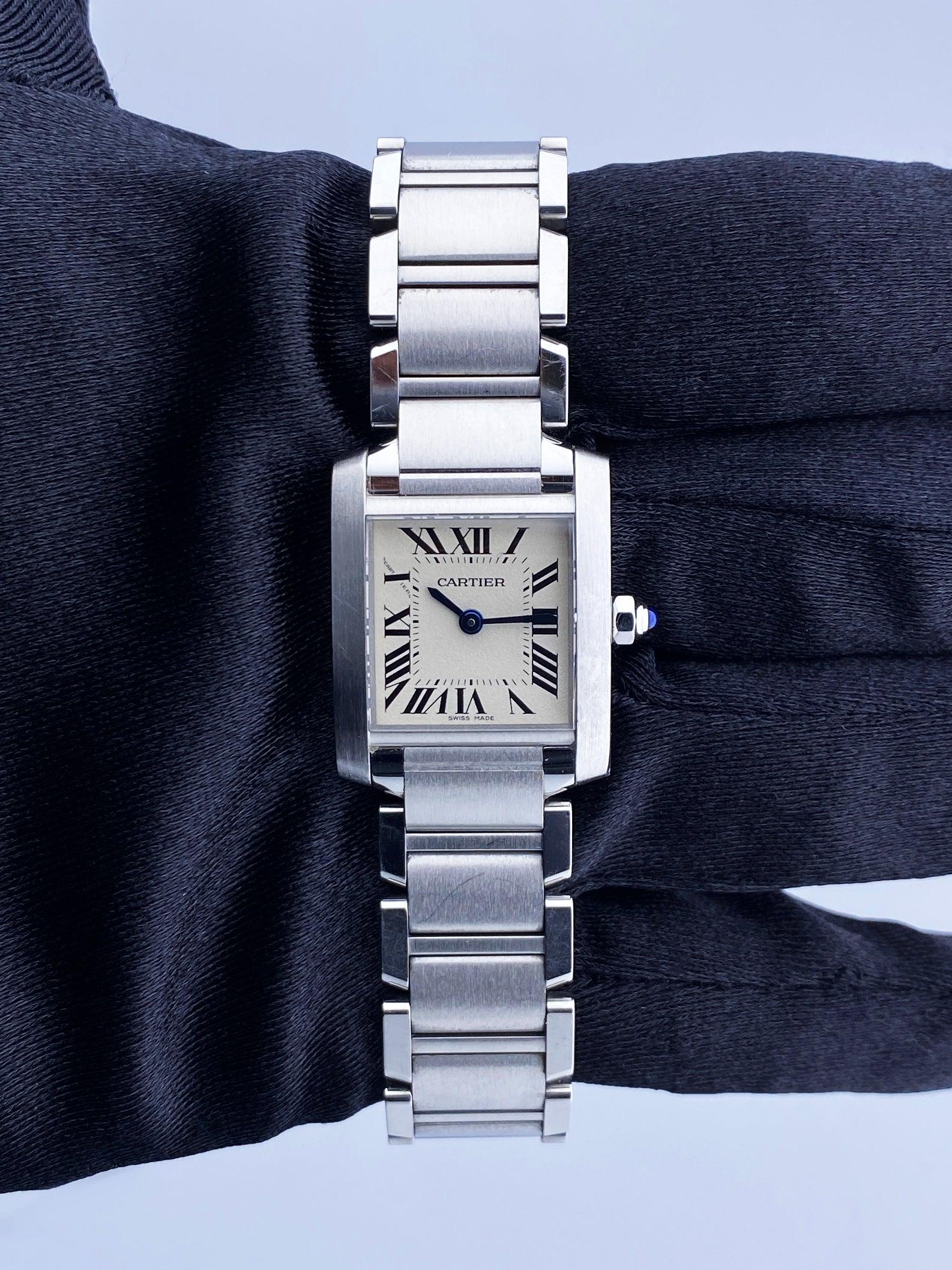 Cartier Tank Francaise 3217 Watch. 20mm stainless steel case with stainless steel bezel. Off-White dial with blue steel hands and Roman numeral hour markers. Minute markers on the inner dial. Stainless steel bracelet with hidden butterfly clasp.