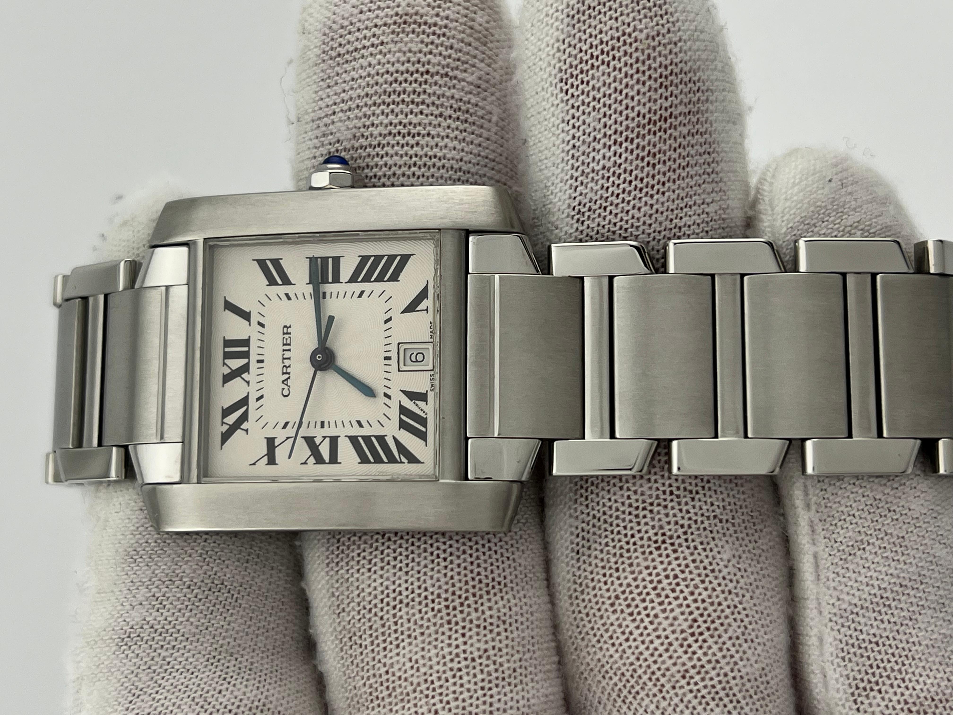 Style Number: 2302


Year: 2002

 

Model: Tank Française

 

Case Material: Stainless Steel

 

Band: Stainless Steel

  

Bezel: Stainless Steel

  

Dial: Silver Guilloche

 

Face: Sapphire Crystal

 

Case Size: 28mm x 32mm

 

Includes: