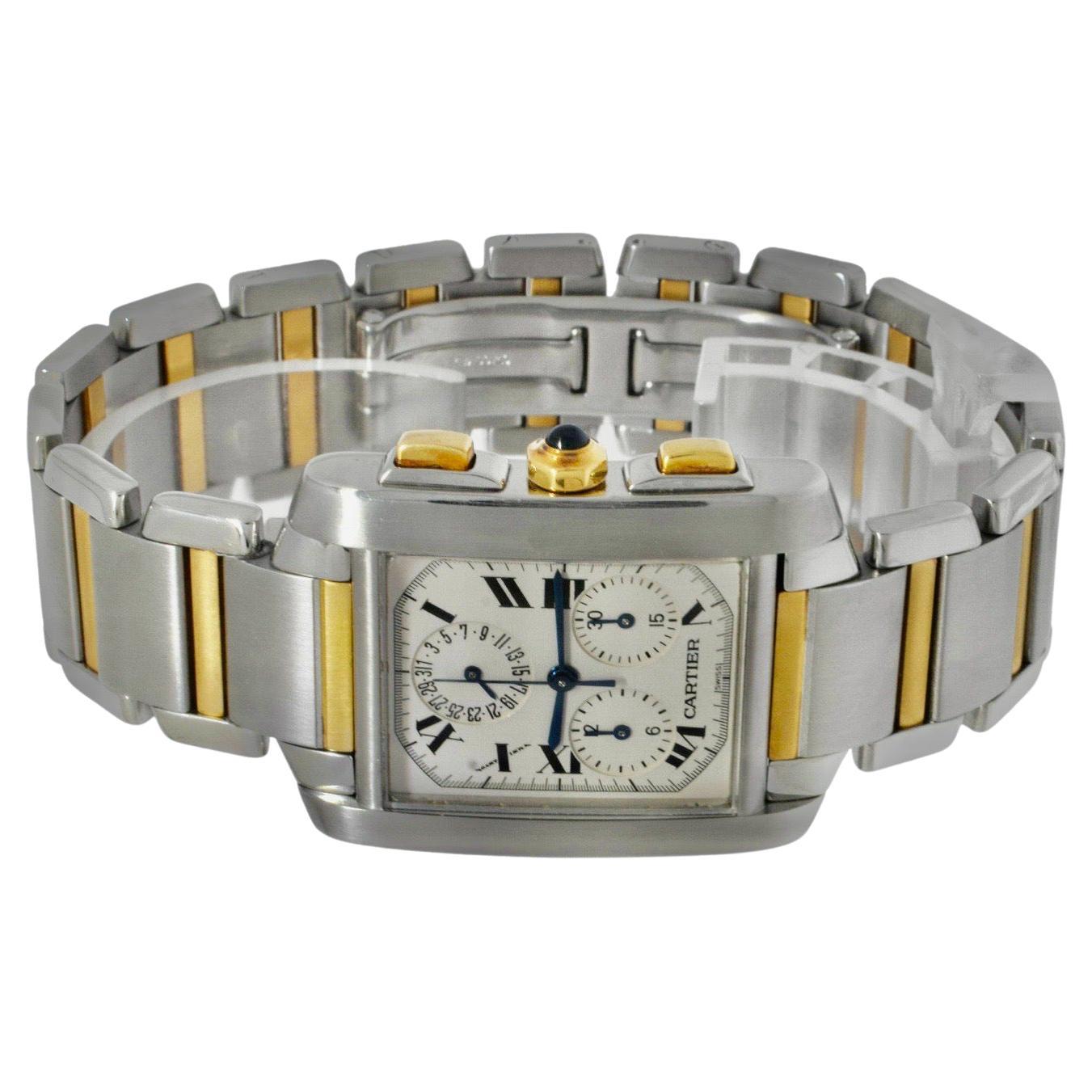Near mint preowned mens/Unisex Cartier Tank Francaise Chronoflex in stainless steel and gold inner links pushers and crown features silver dial with Roman numerals. Unique perpetual date display with chronograph movement.
Brand: Cartier
Model:Tank