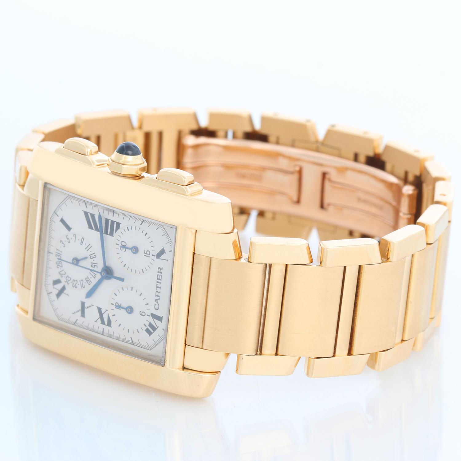 Cartier Tank Francaise Chronograph Men's 18k Gold Watch  W5000556 - Quartz chronograph with date. 18k yellow gold case (28mm x 36mm). Ivory colored dial with hours, minutes and seconds; black Roman numerals. 18K Yellow Gold Cartier Bracelet; fits a