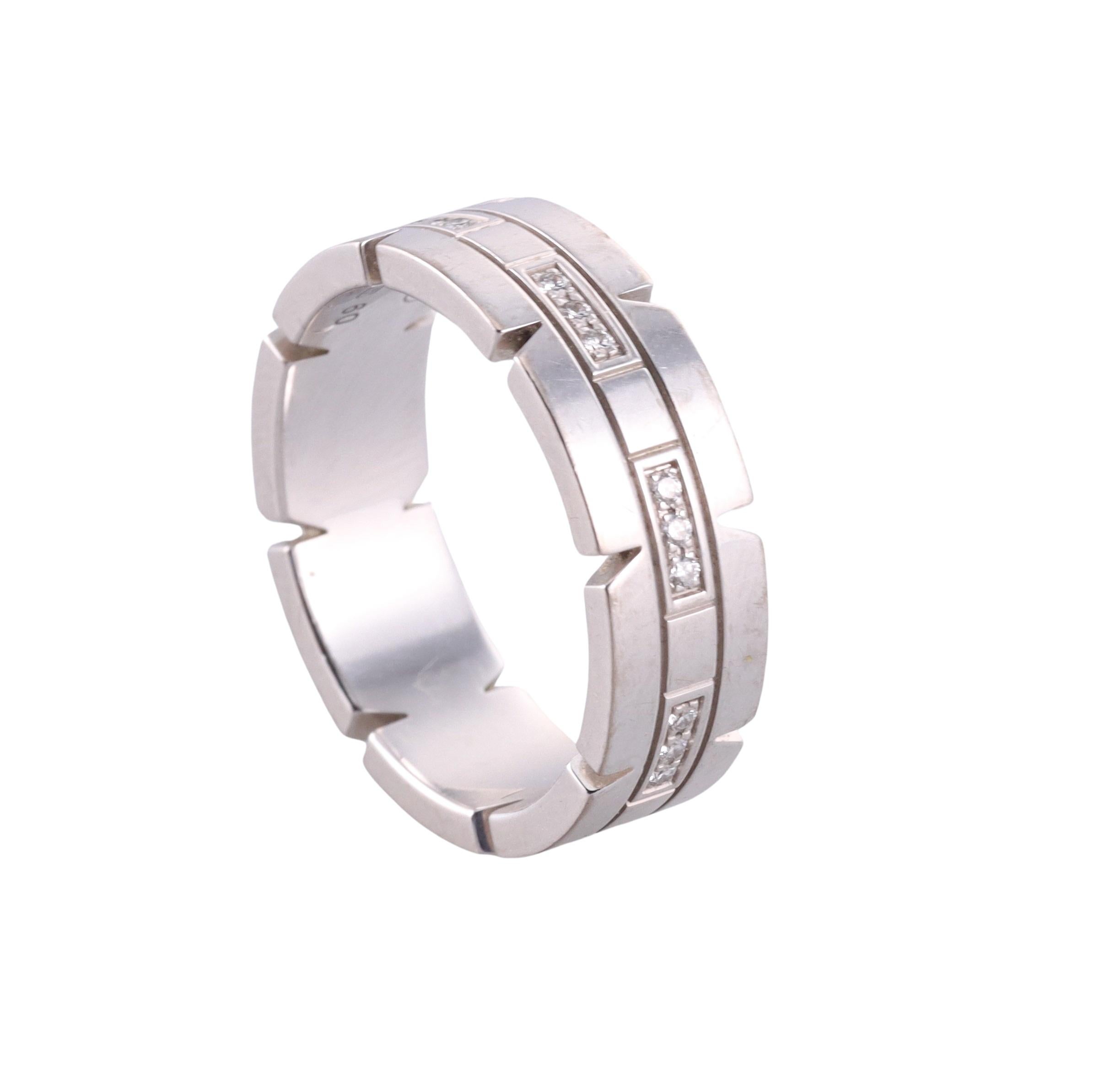 An 18k white gold band ring by Cartier, from Tank Francaise collection, set with 0.16ctw G/VS diamonds. Ring is a size 9 (Euro size 60), width 7mm. Comes in vintage Cartier box. Marked: Cartier, 750, 60, QG6089. Weight - 11.9 grams. 