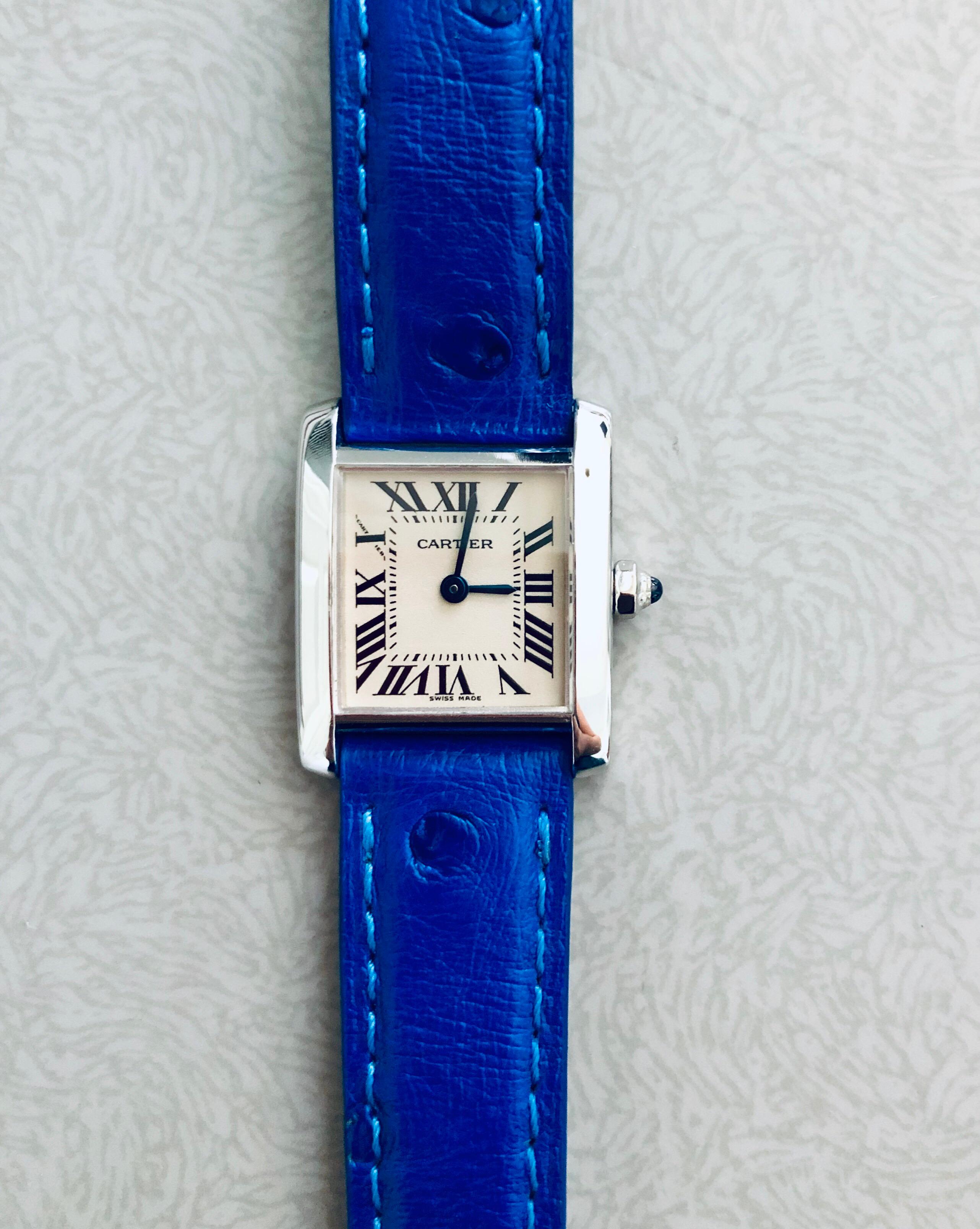 Cartier 18K White Gold Tank Francaise. Only one owner, watch purchased in 2001 directly through Cartier. Completely serviced recently with stunning new cobalt blue Ostrich band. 18k white gold case dimensions are 20 mm by 25 mm.
