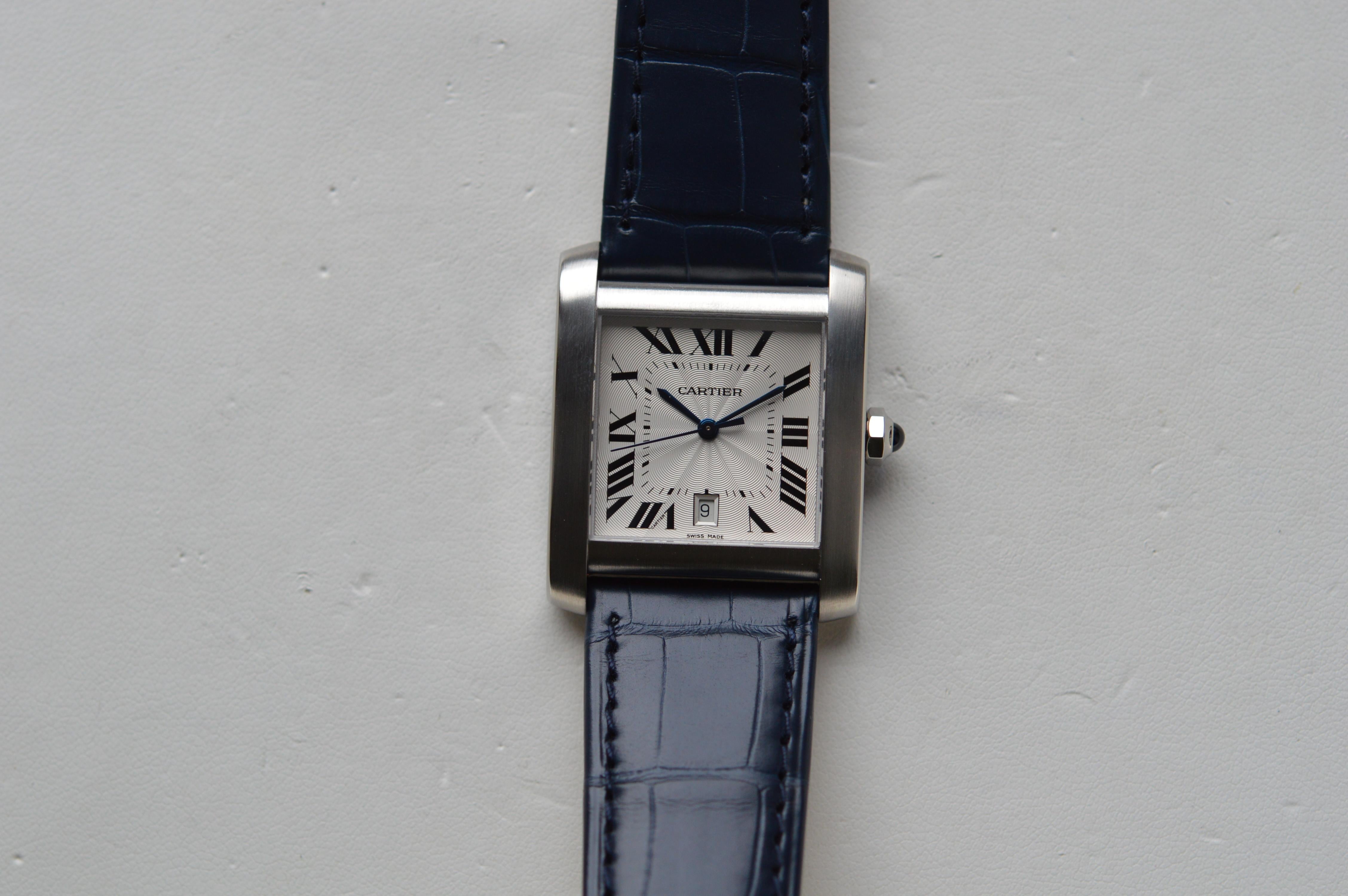 Cartier Tank Française
Reference n° W5101755
Grand Model (GM)
Stainless Steel
36mm X 30mm Size
Blue Leather Strap
Automatic Movement
Roman Numerals
Guilloché White Dial
Blue Cabochon Crown
Water Resistant 3ATM - 30M - 100FT
New Old Stock