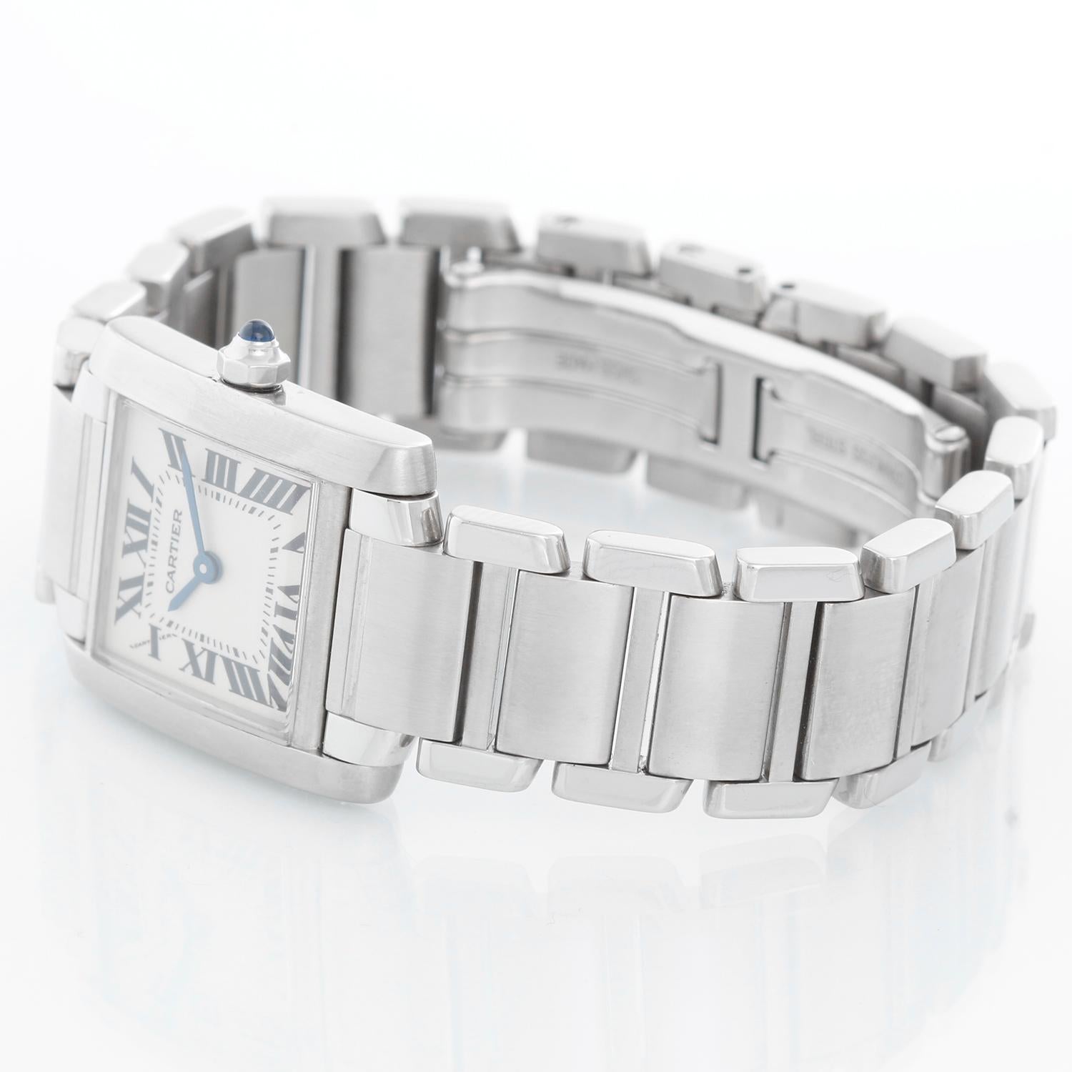 Cartier Tank Francaise Ladies Stainless Steel Watch 2300 - Quartz. Stainless steel case (20mm x 25mm). Ivory colored dial with black Roman numerals. Stainless steel Cartier band. Pre-owned with custom box.