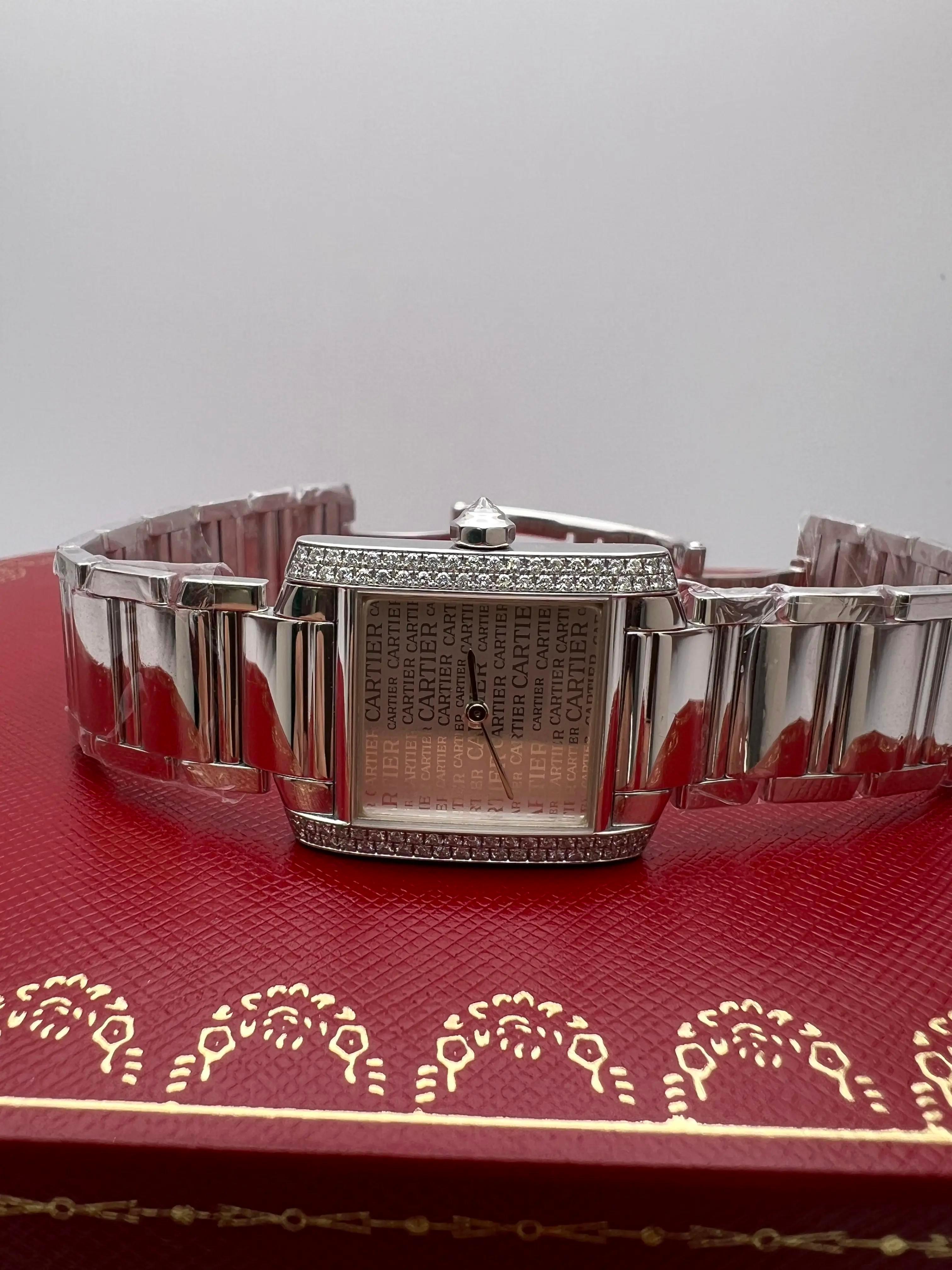 Pristine condition Cartier Tank Française (ref. WE1025S3) offers classic elegance with a luxurious twist. Crafted in solid 18K white gold, with a case measuring 25mm x 30mm it features a factory original diamond-set bezel and crown that complement