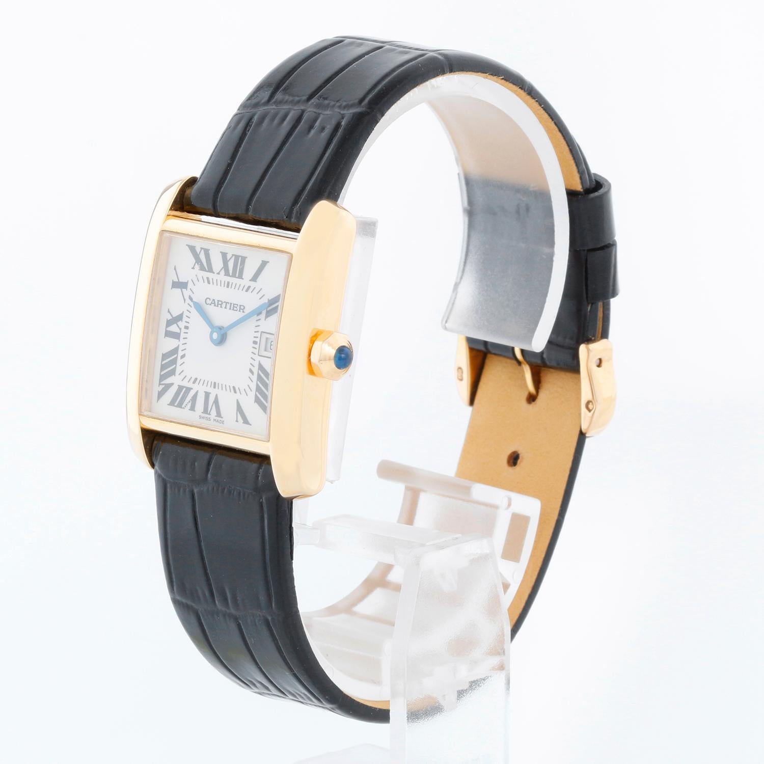 Cartier Tank Francaise Midsize 18k Yellow Gold Men's/Ladies Watch W50014N2 - Quartz. 18k yellow gold  case; blue sapphire cabochon crown (25mm x 30mm). Ivory colored dial with black Roman numerals; date at 3 o'clock. Leather strap with gold Cartier