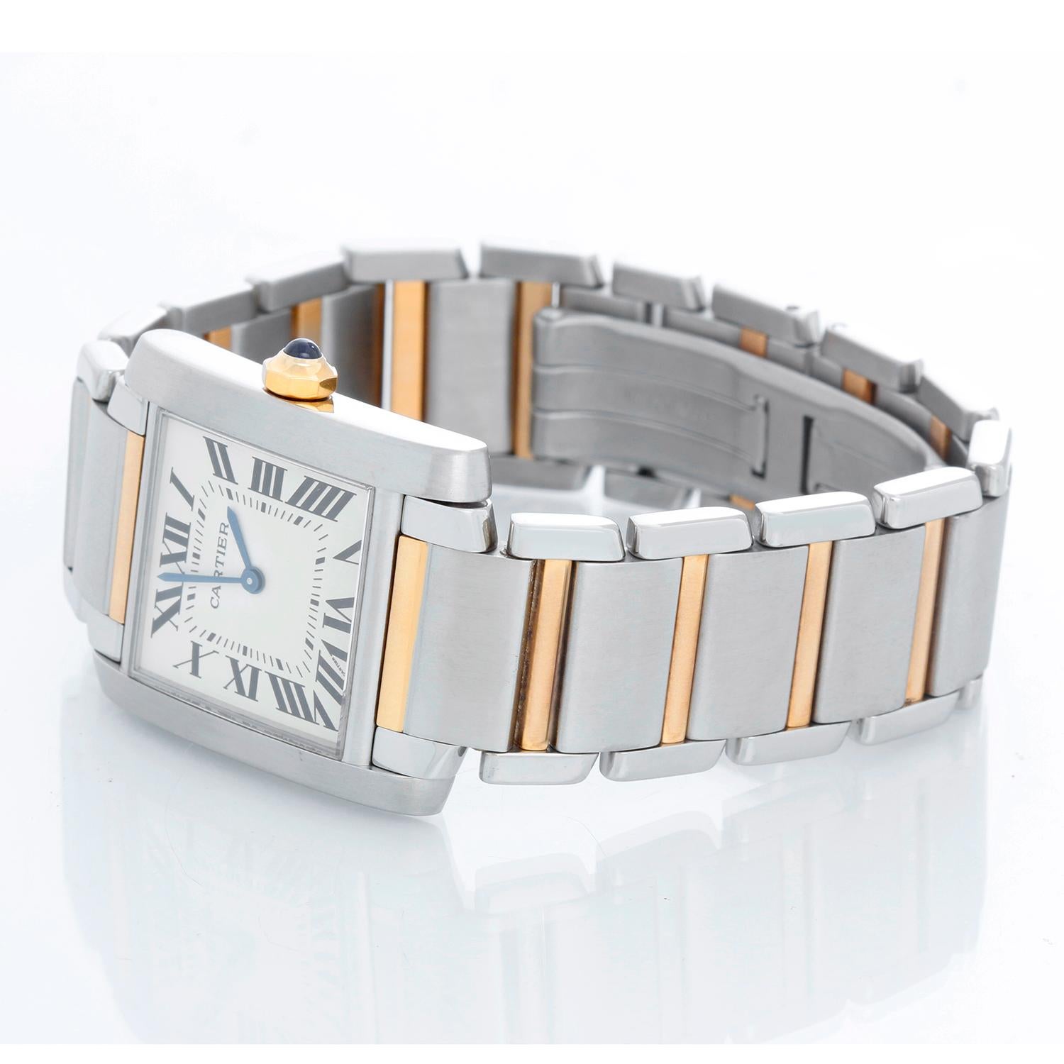 Cartier Tank Francaise Midsize 2-Tone Steel & Gold Watch W51006Q4 - Quartz. Stainless steel and yellow gold case  (25mm x 30mm). Ivory colored dial with black Roman numerals. Stainless steel and yellow gold Cartier bracelet with deployant clasp.