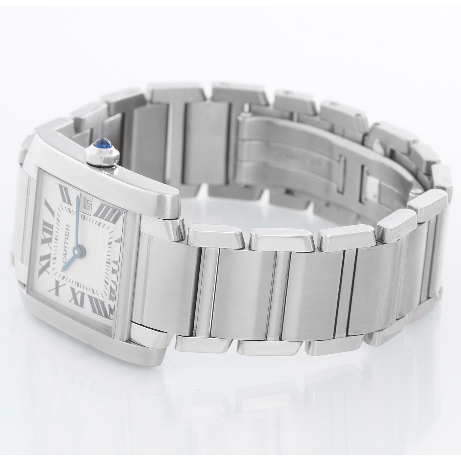 Cartier Tank Francaise Midsize Stainless Steel Watch 2465 - Quartz. Stainless steel case (25mm x 30mm). Ivory colored dial with black Roman numerals; date at 3 o'clock. Stainless steel Cartier bracelet with deployant clasp. Pre-owned with custom box
